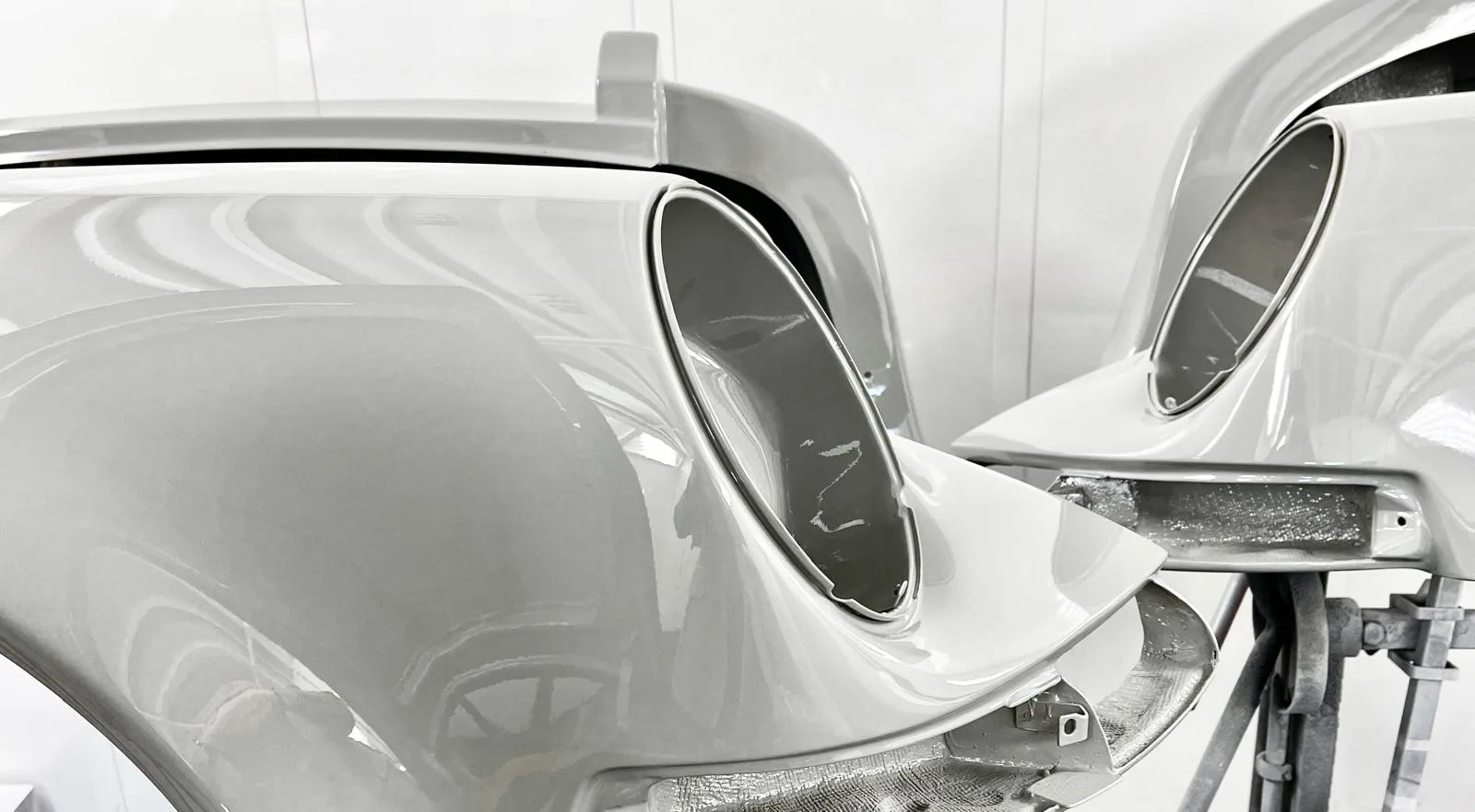 A side profile of a Kalmar Automotive Porsche 911 restomod in the paintshop