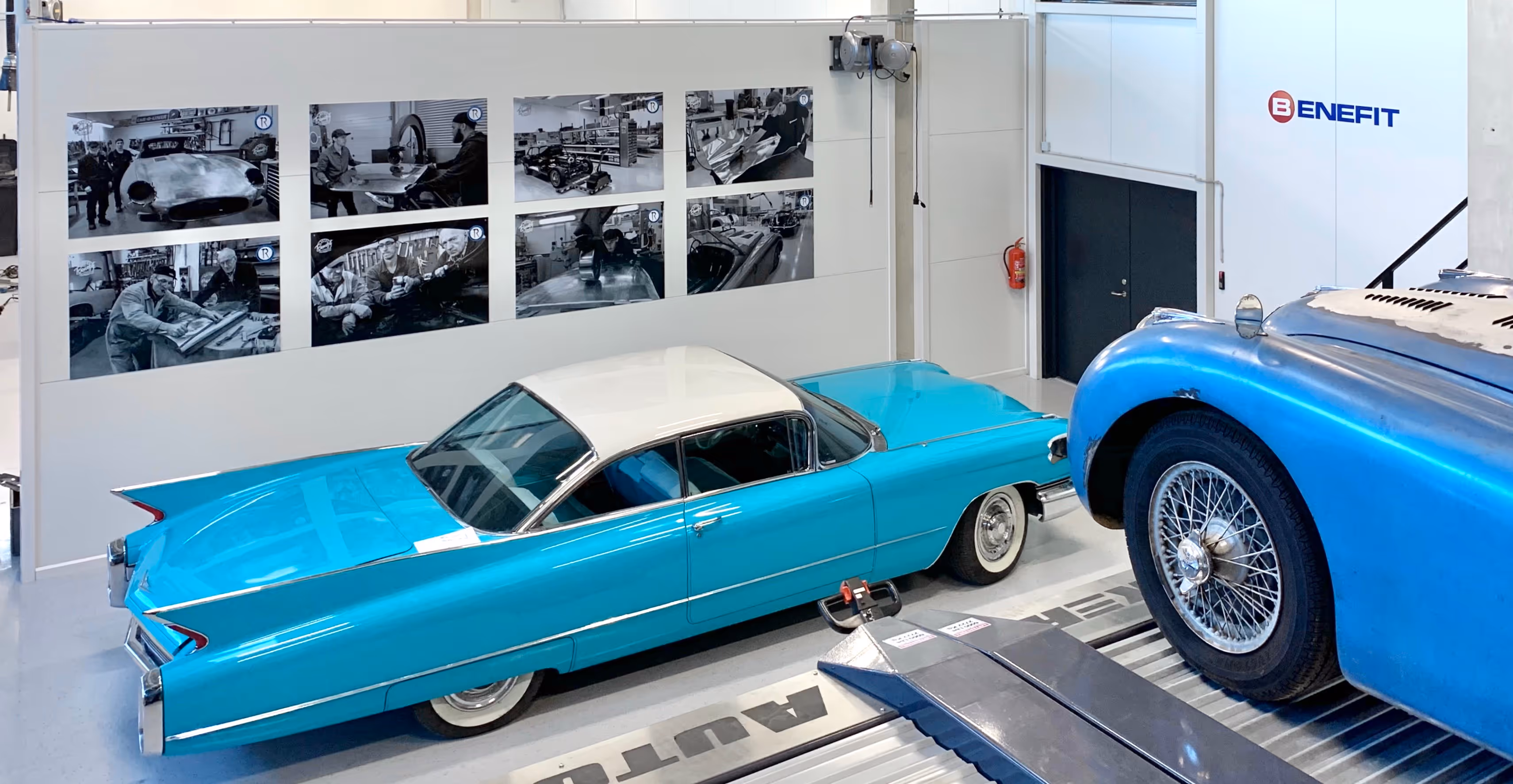 Blue Cadillac De Ville in Benefit's storage next to Jaguar XKJ