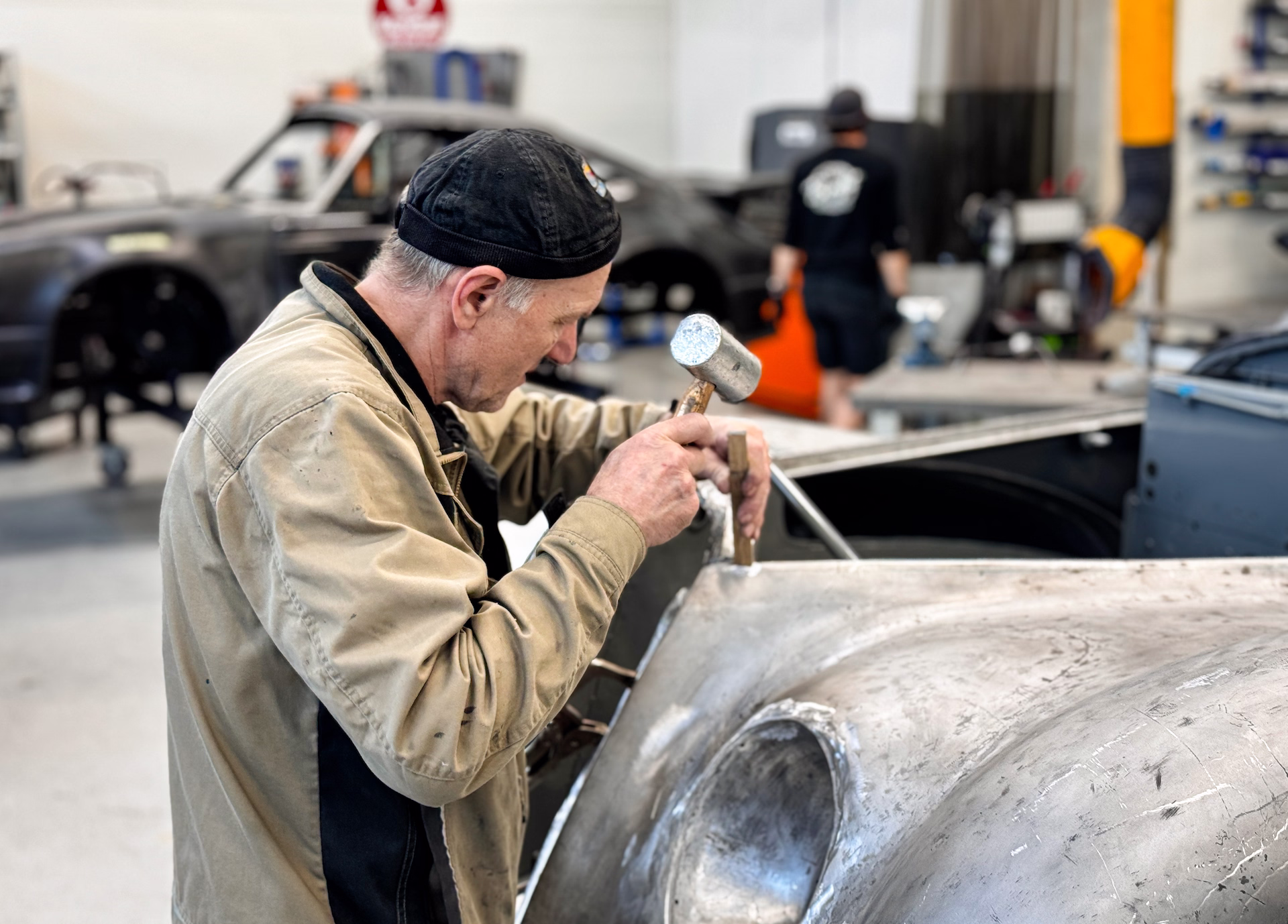 Vello Pross restoring an old Alfa-Romeo in Benefit Autoklassika garage