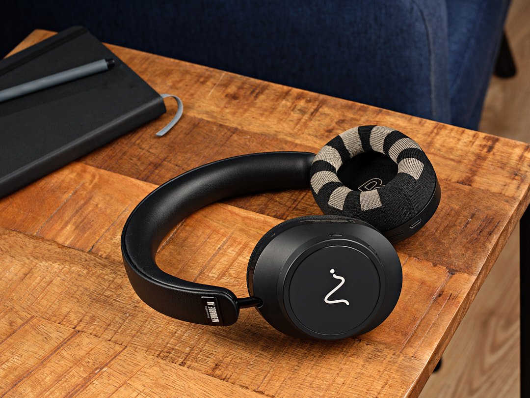 Neurable One headphones resting on a wooden desk