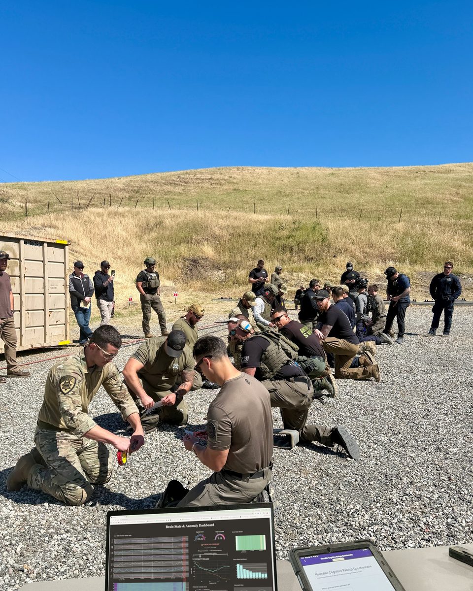 A team training in the field with Neurable readiness data on a laptop
