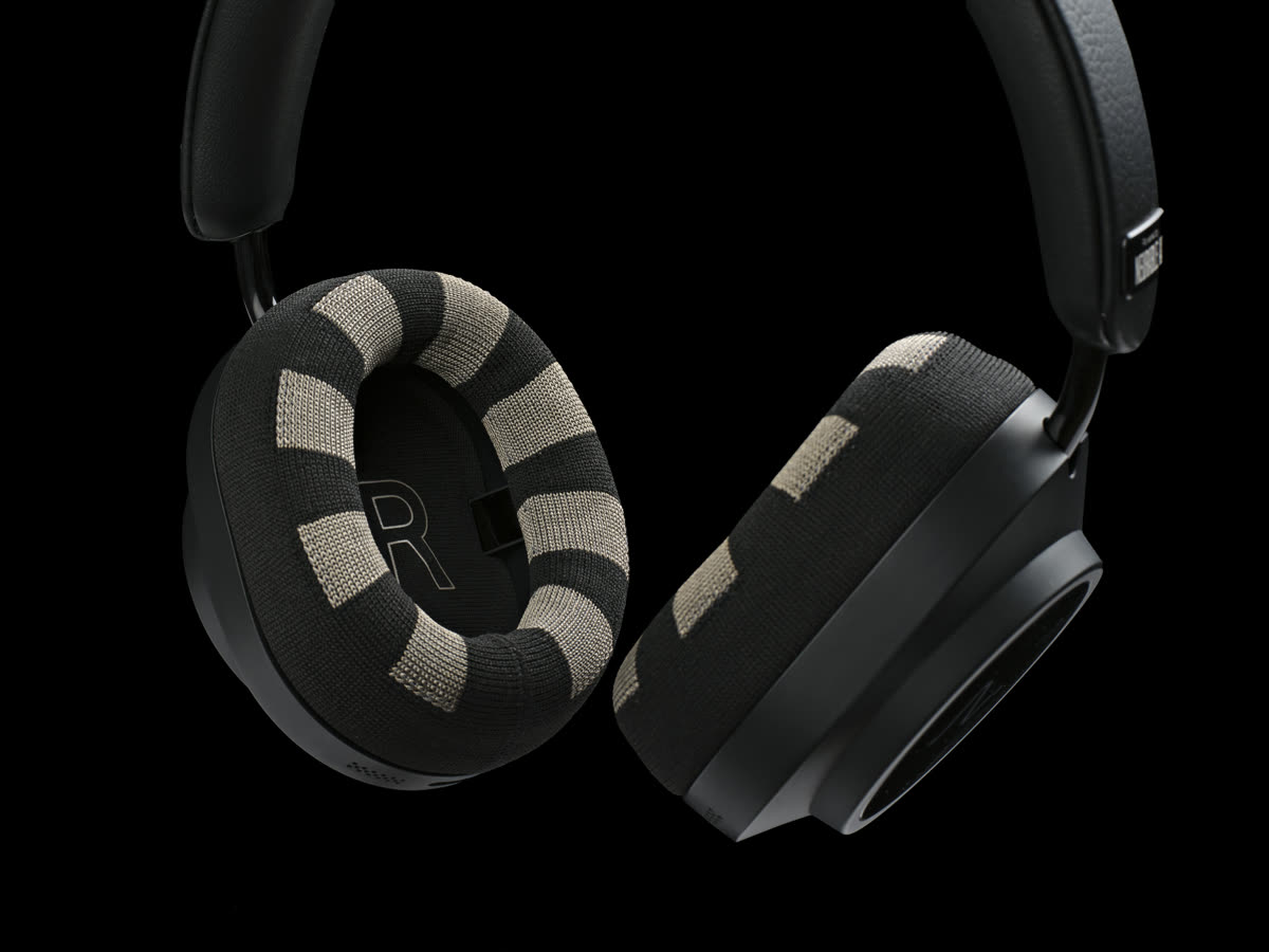 Close-up of two Neurable One ear pads with a sand and black woven pattern.