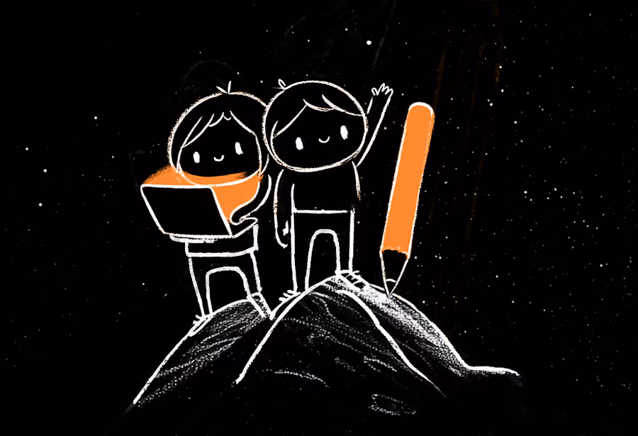 Two team members standing on the top of a mountain