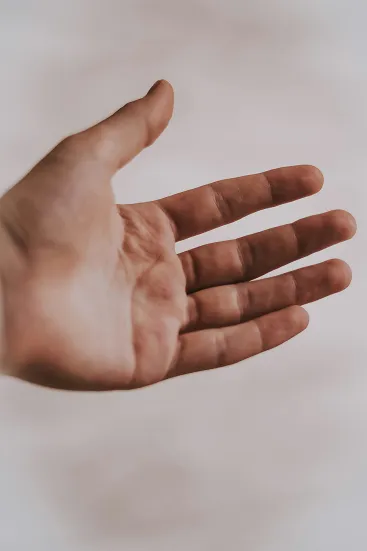 A hand palm facing and outreached