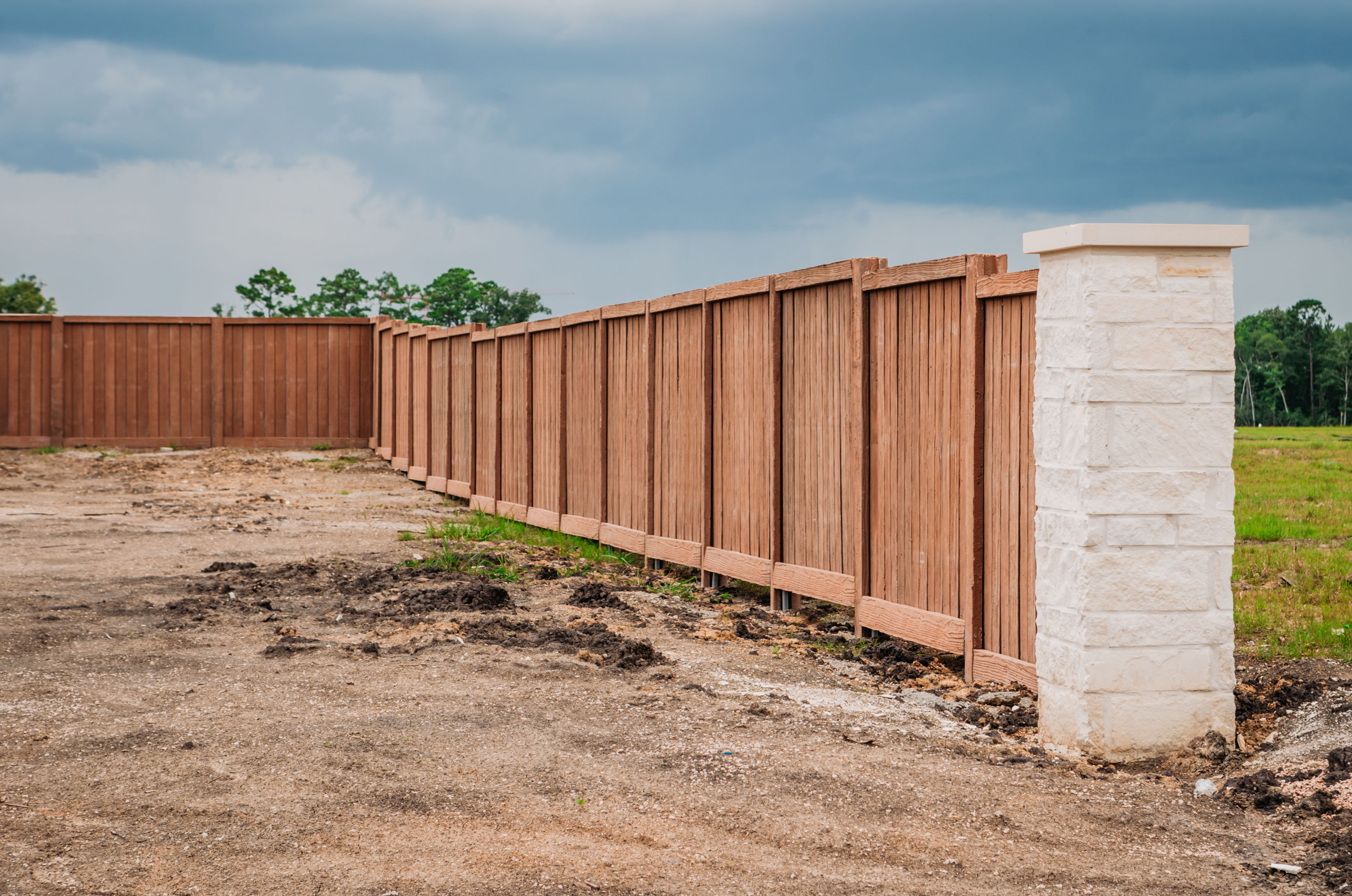 Perimeter Fence using Stone Masonry Columns and infill Wood Fence