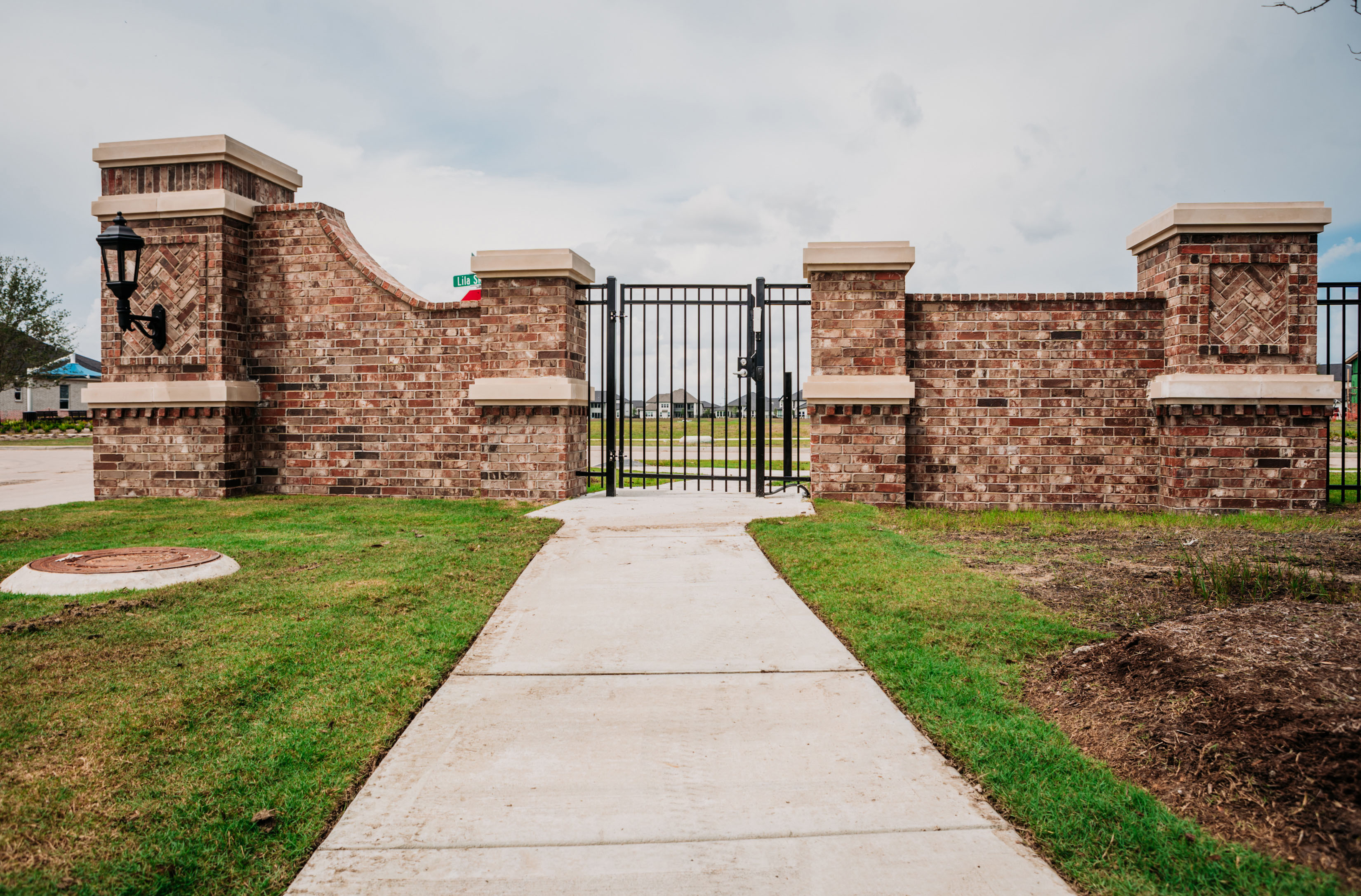 Pedestrian Entry Gate in Decorative Masonry Wall for Secured Access to the Residential Community