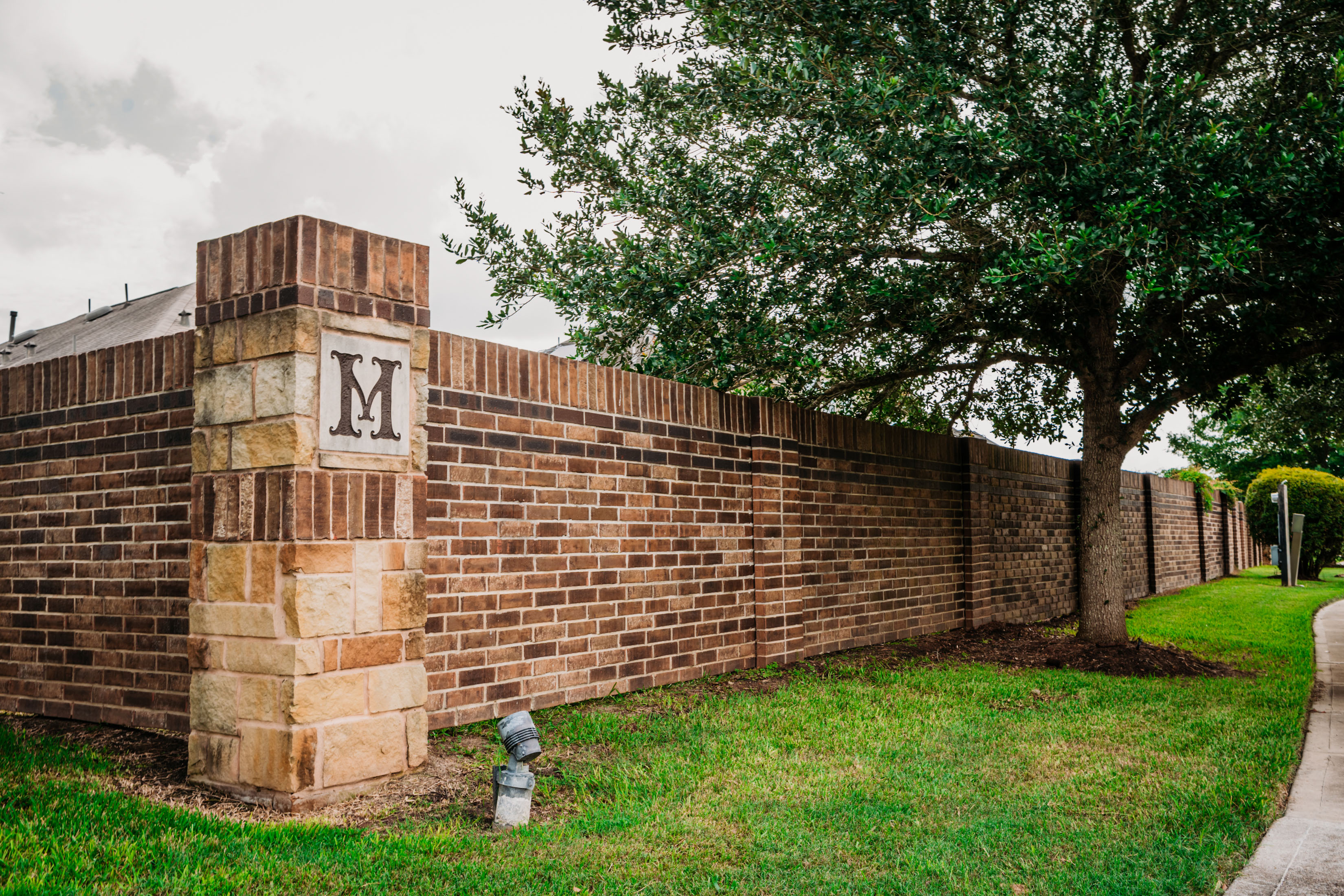 Brick Wall and Decorative Columns with Community Identity Marker