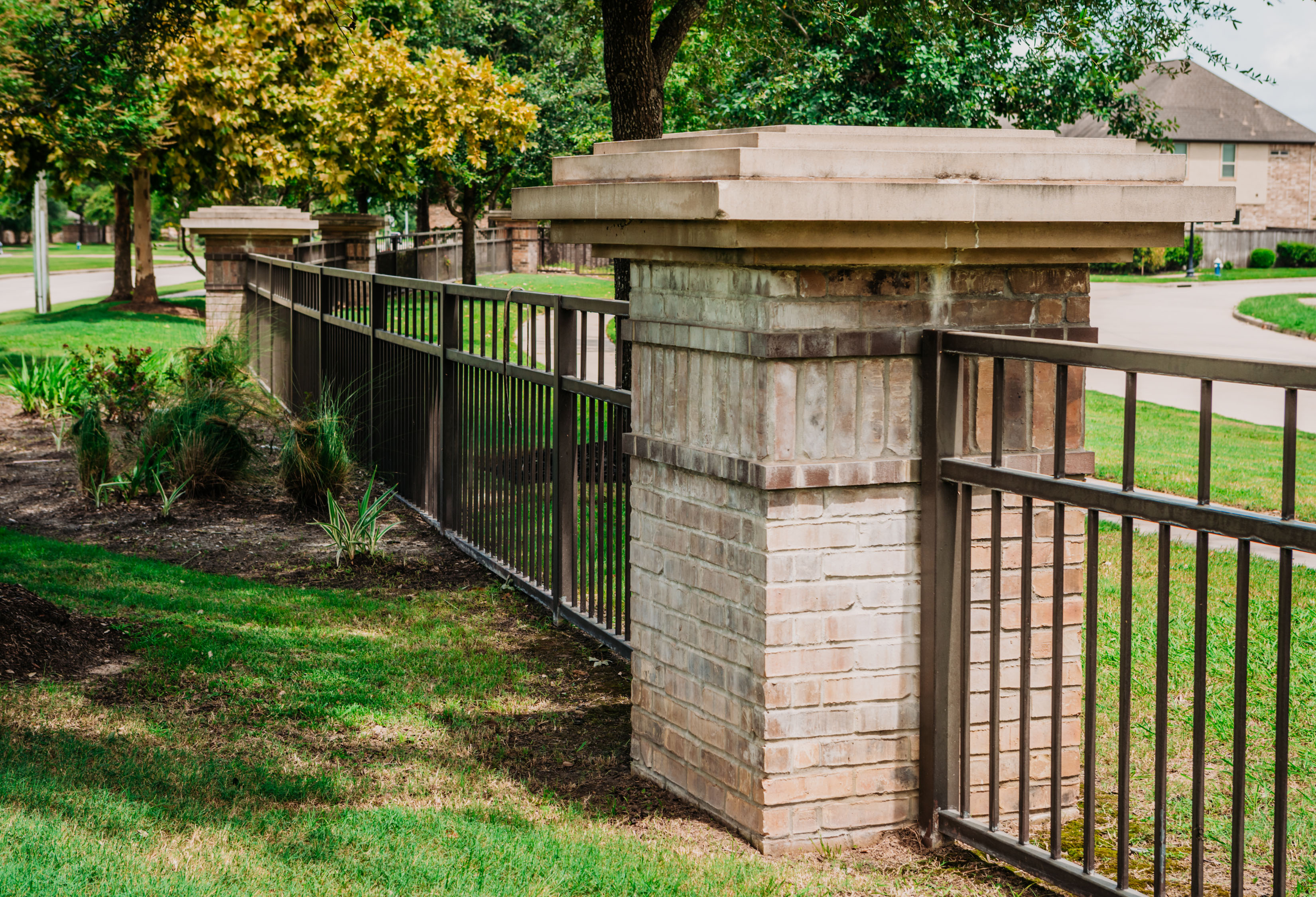 Decorative Brick and Stone Columns with infill Iron Fence