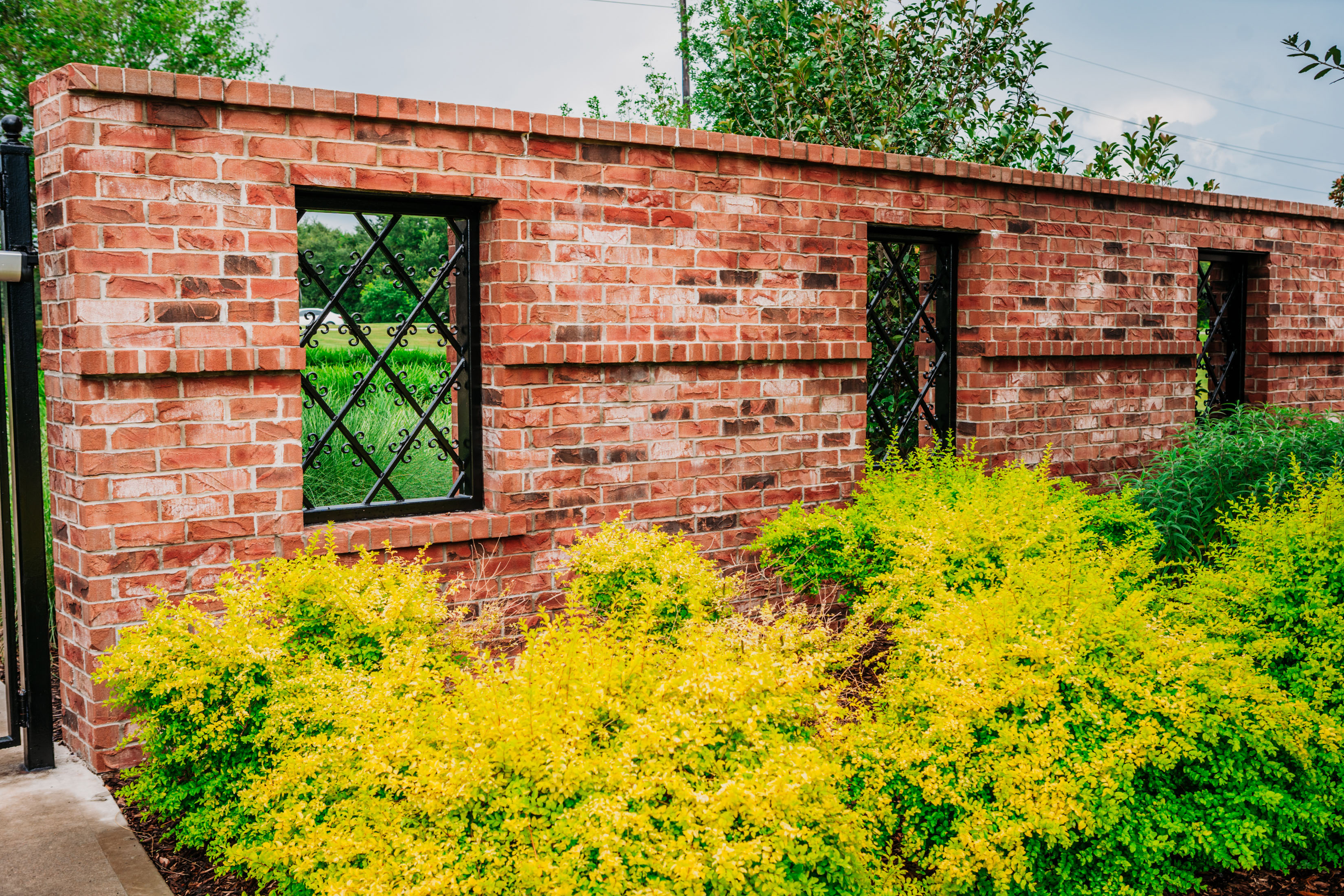 Brick Masonry Wall with elegant Ornamental Iron inset