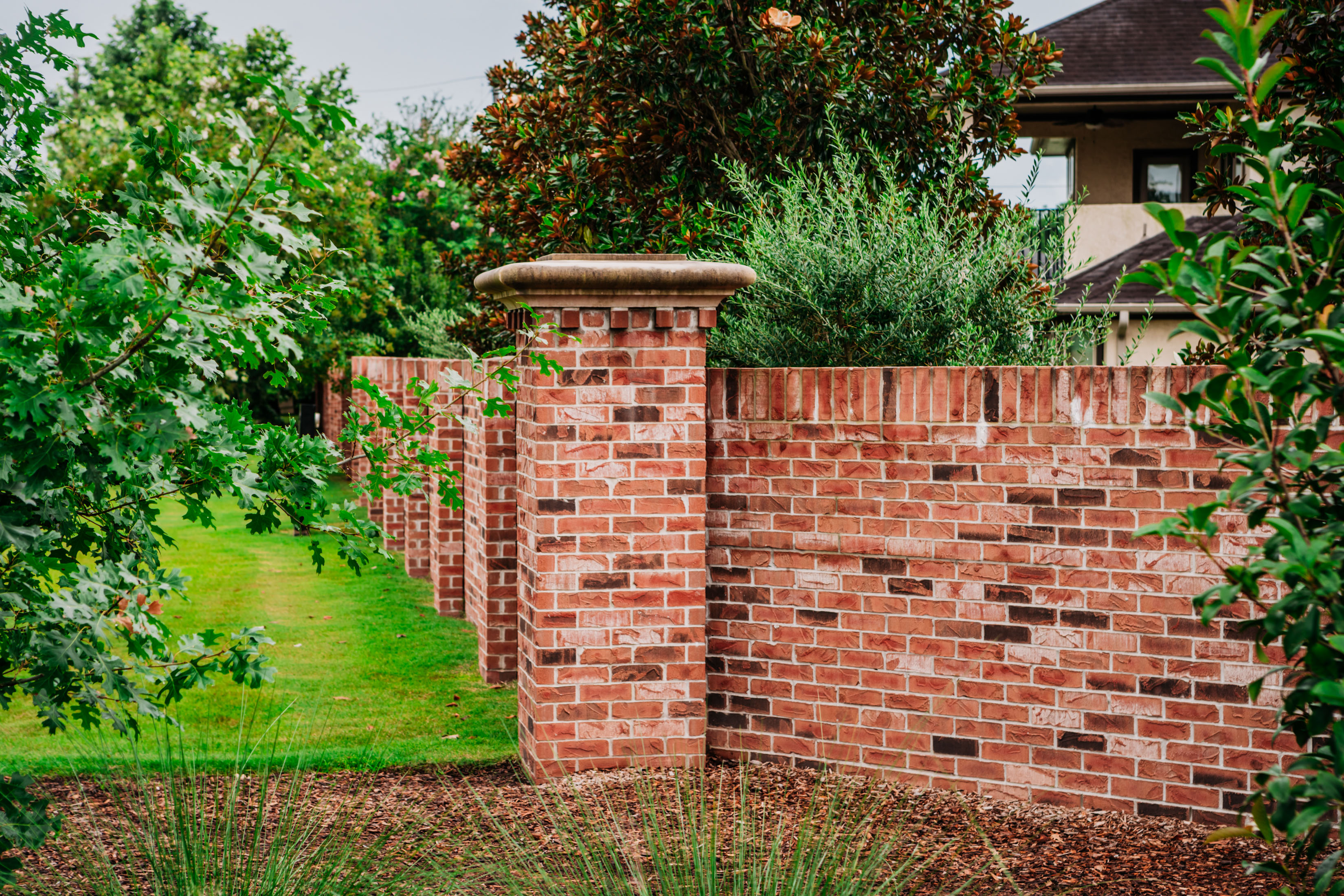 Brick Perimeter Wall in color complementing the Community aesthetics