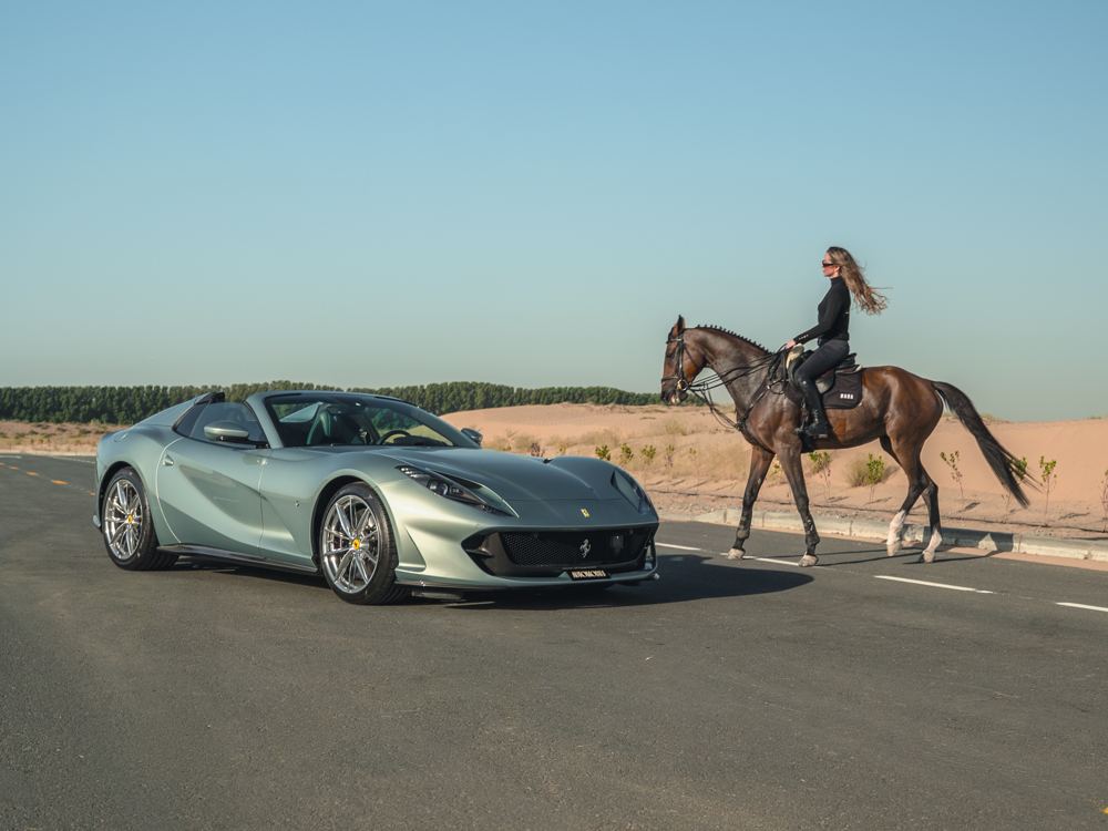 Ferrari 812 with a rider on horseback