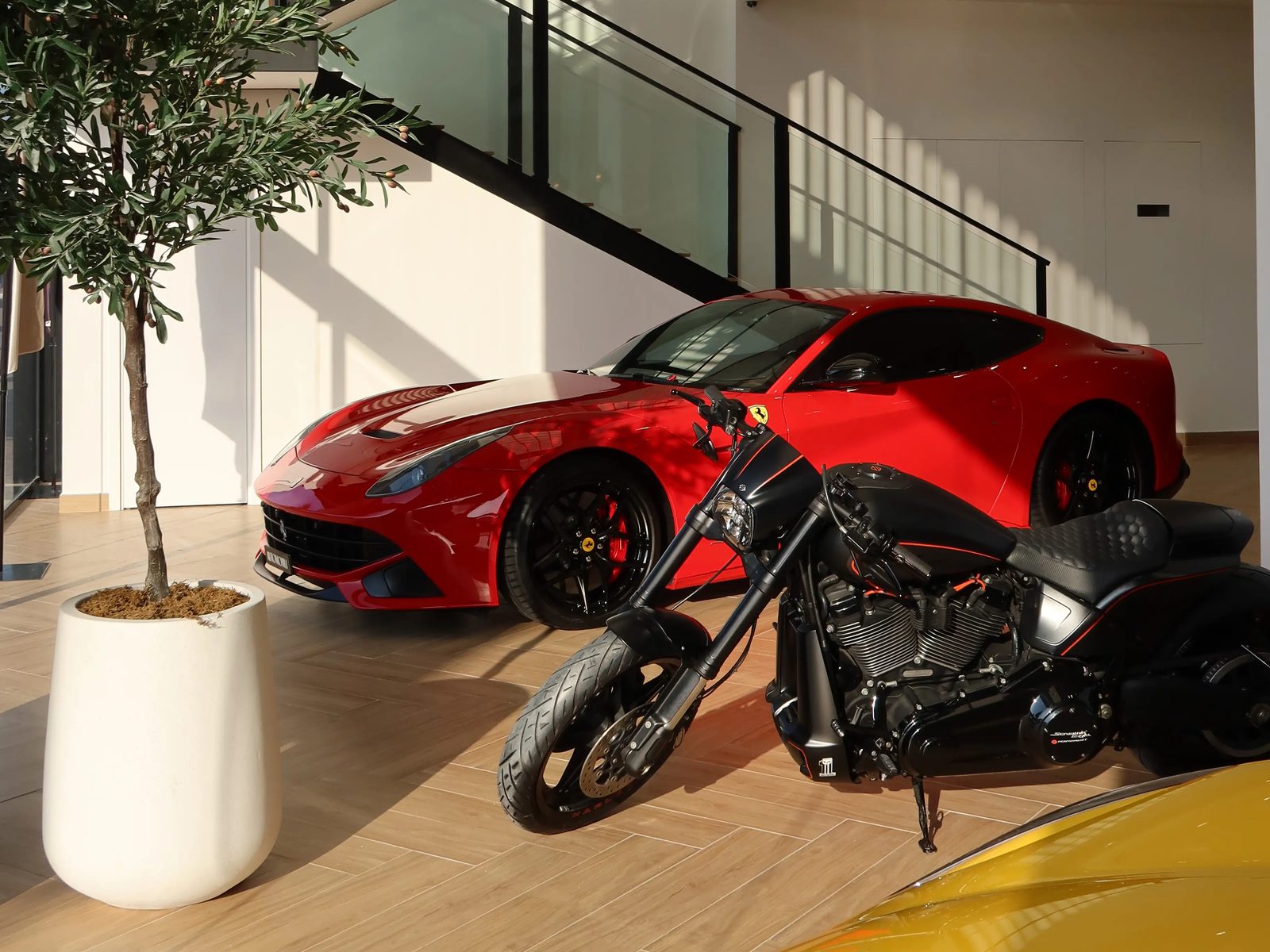 Ferrari F12 at the entrance of the Automobili Motors showroom