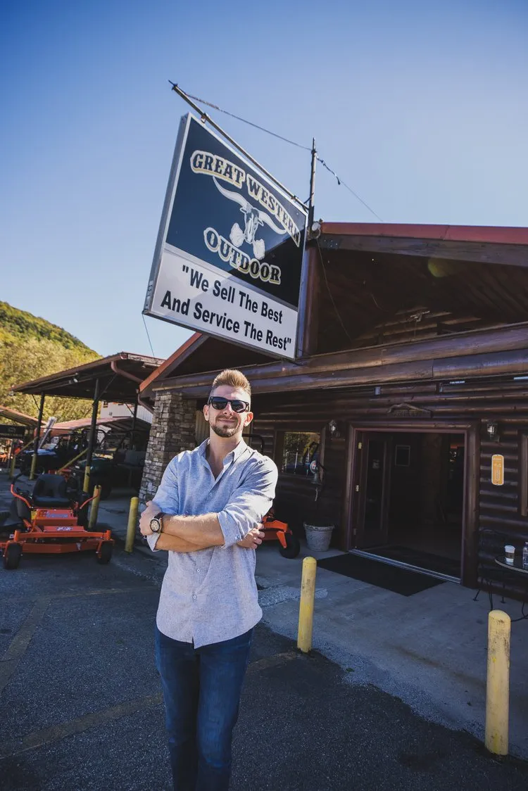 Dealership owner Brandon Prokupek standing in front of his dealership Great Western Outdoor