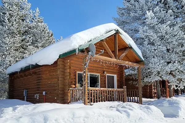 The Fuschl Comfort XL room in the Arabella Jagdhof Resort am Fuschlsee showing a bed and two chairs