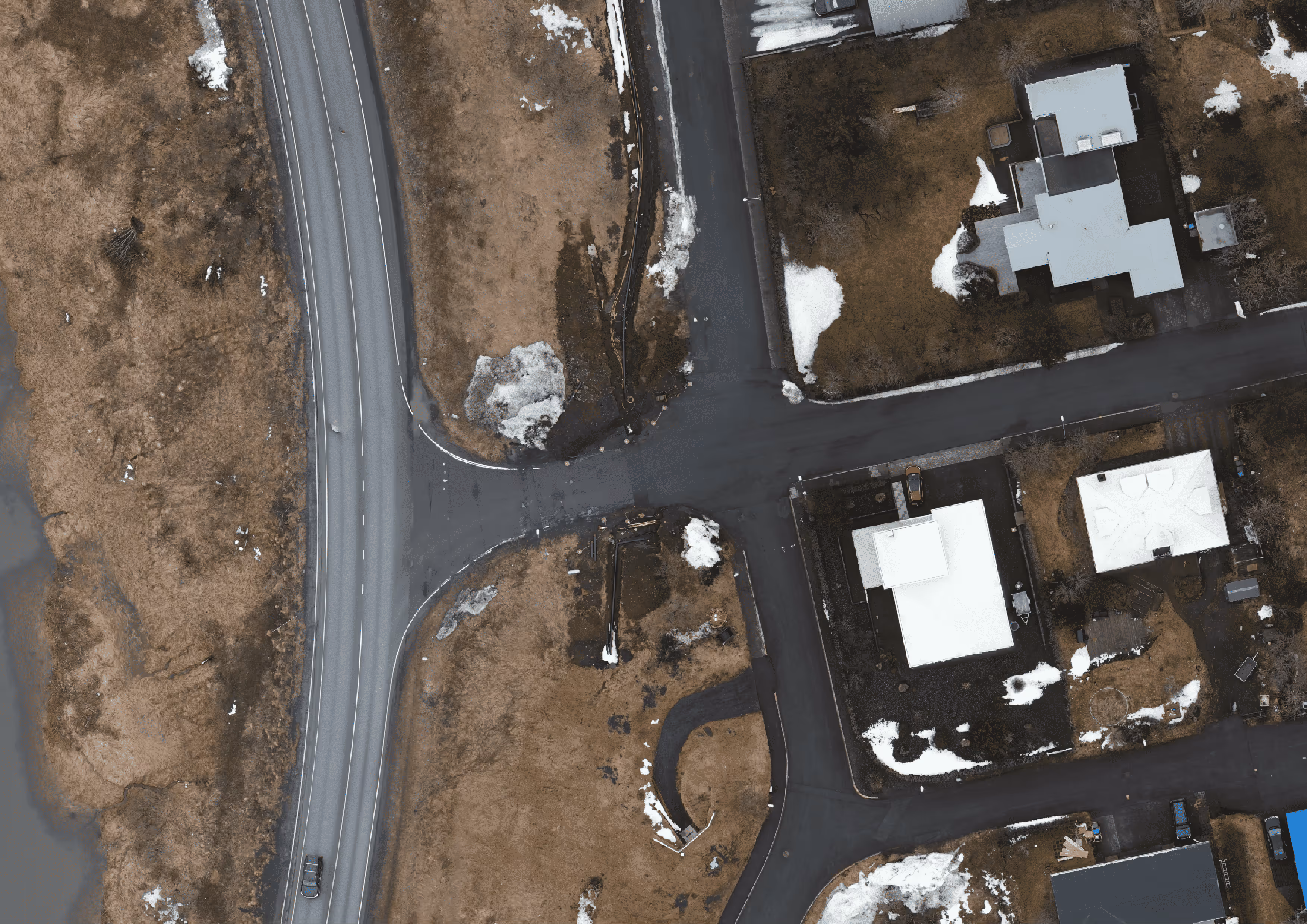 Aerial shot of land with development on it shot from drone | Svarmi