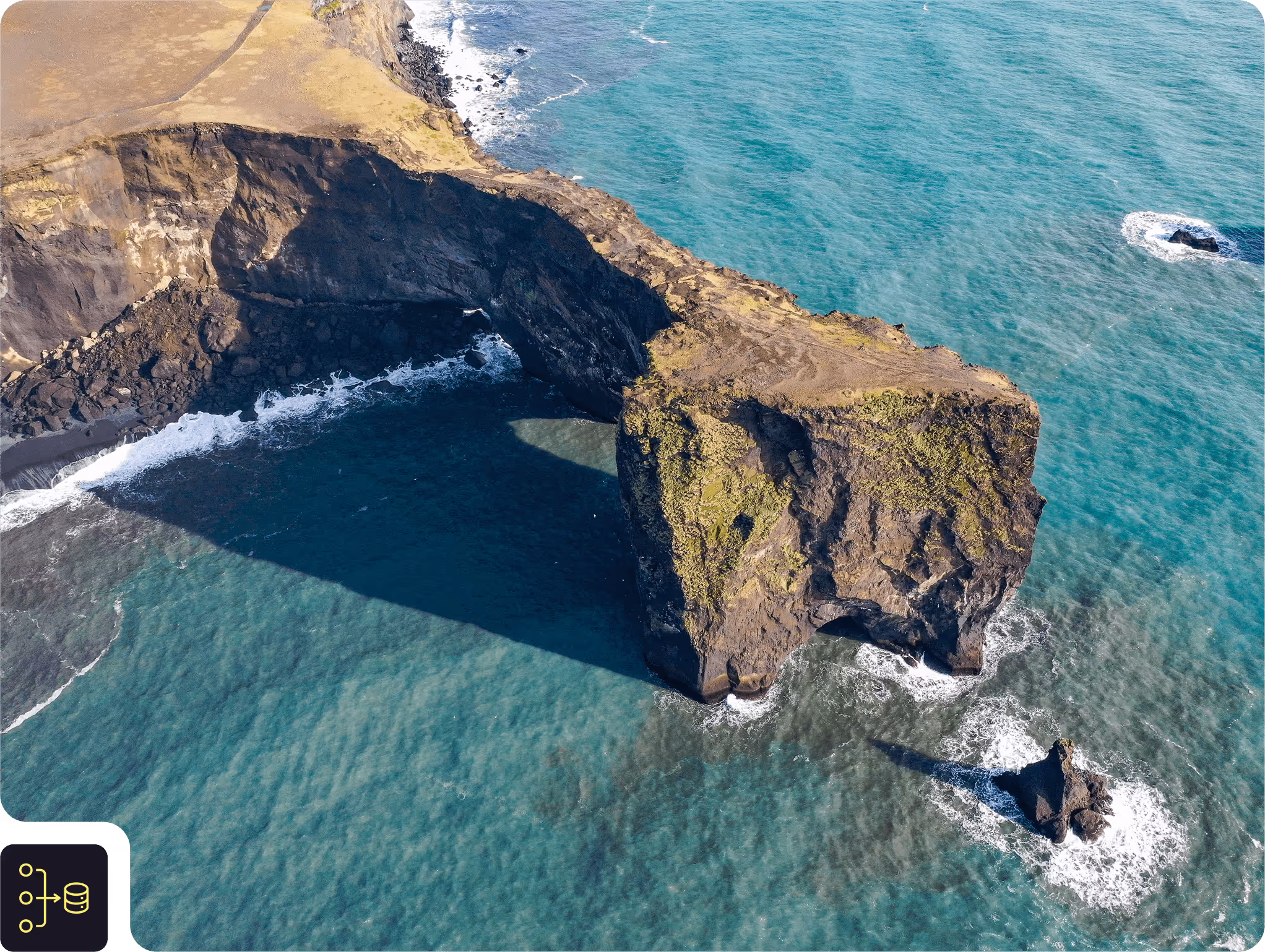 Datact Drone shot of Cliff side with Ocean waves crashing into it | Svarmi