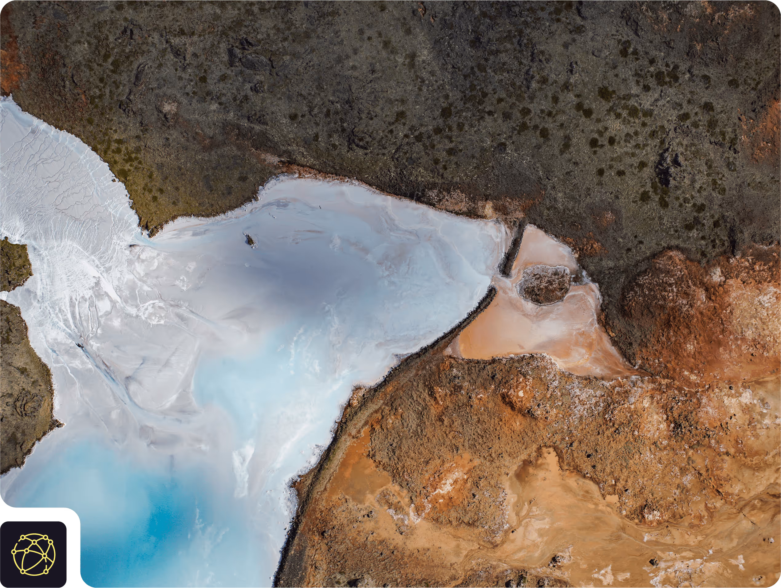 Aerial shot of land mass meeting sea and forest | Svarmi