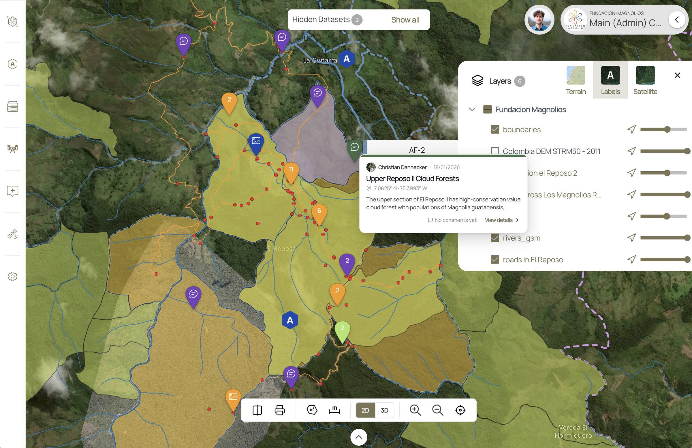 Fundación Magnolios reserve in Svarmi's DATACT platform — boundaries, river and trail layers, and geotagged field pins over satellite imagery, with an annotated cloud-forest point opened