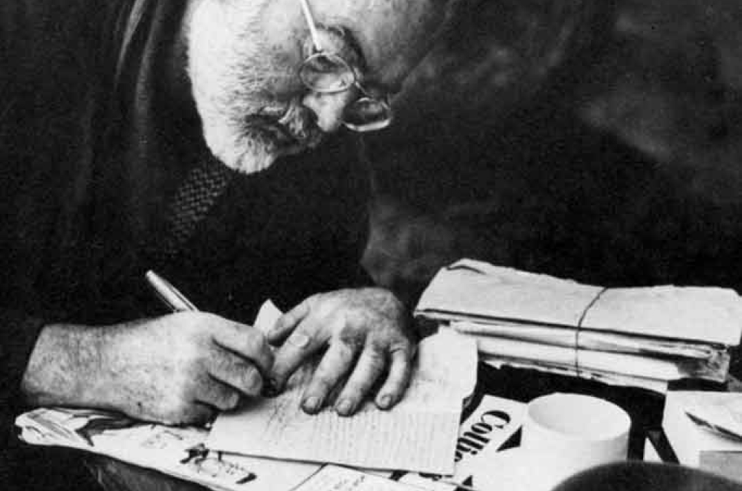 Ernest Hemmingway writing in