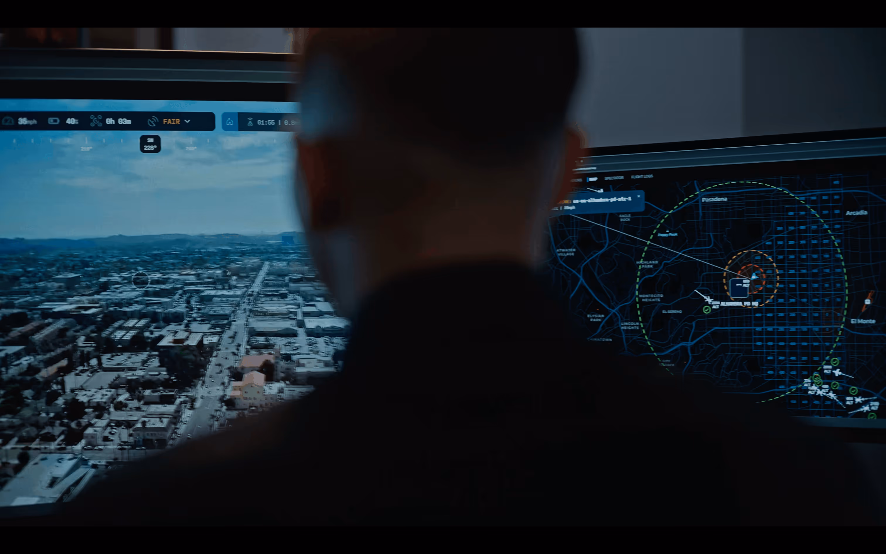 Drone pilot monitoring live aerial footage and a tactical map using the Flock Safety Aerodome DFR system