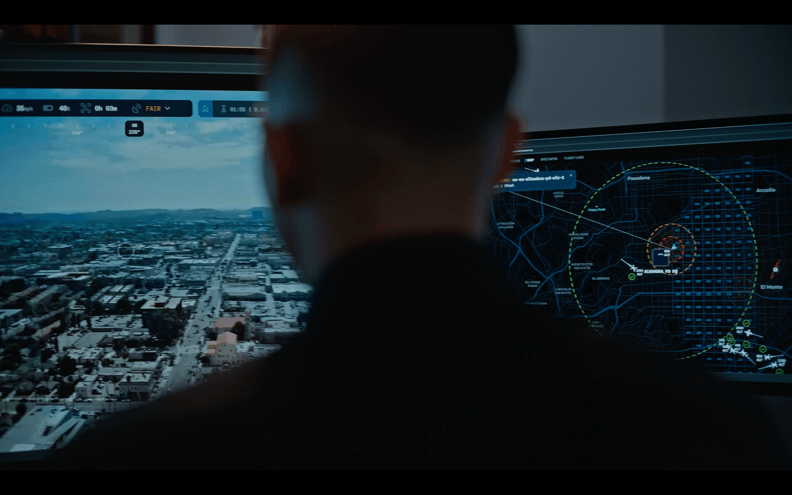 Drone pilot monitoring live aerial footage and a tactical map using the Flock Safety Aerodome DFR system