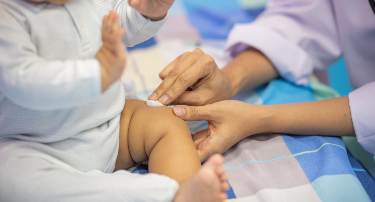 Baby being treated after a vaccination shot