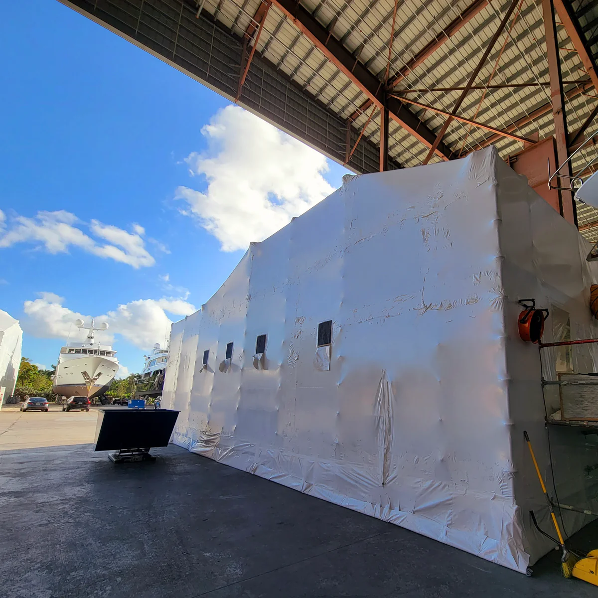 Yacht fully enclosed during repairs to ensure safety and quality access