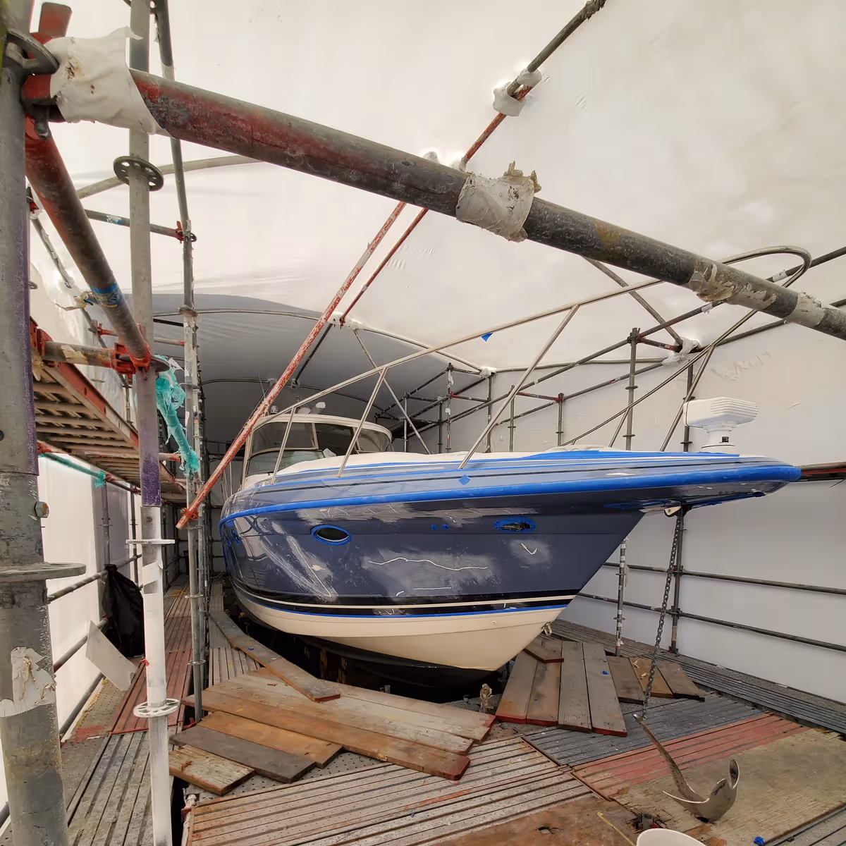 Visible damage to the yacht following a collision, ready for restoration