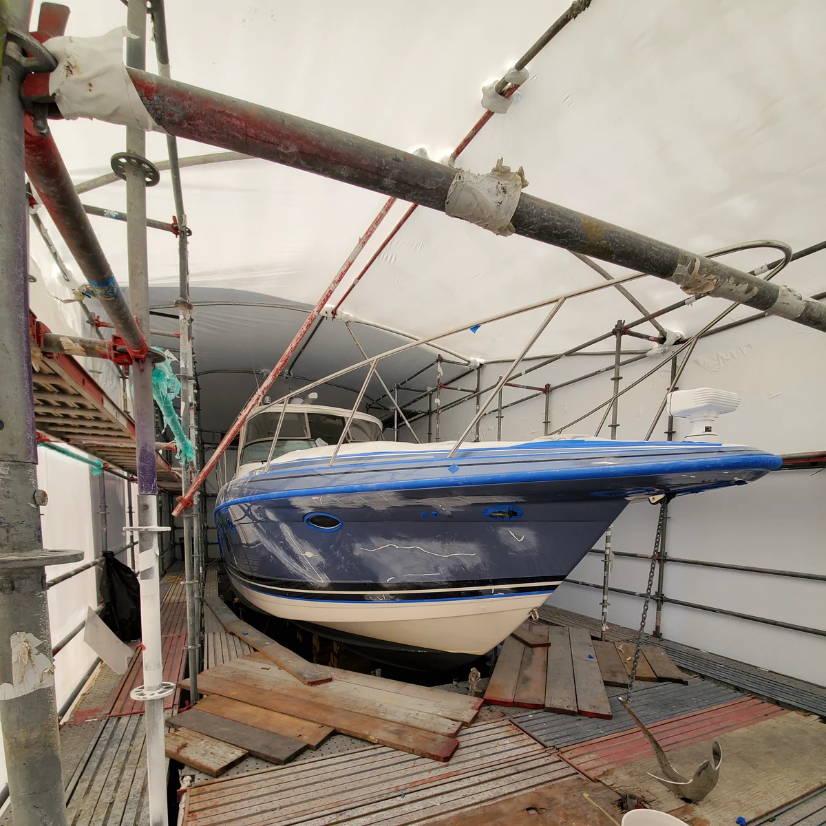 Visible damage to the yacht following a collision, ready for restoration
