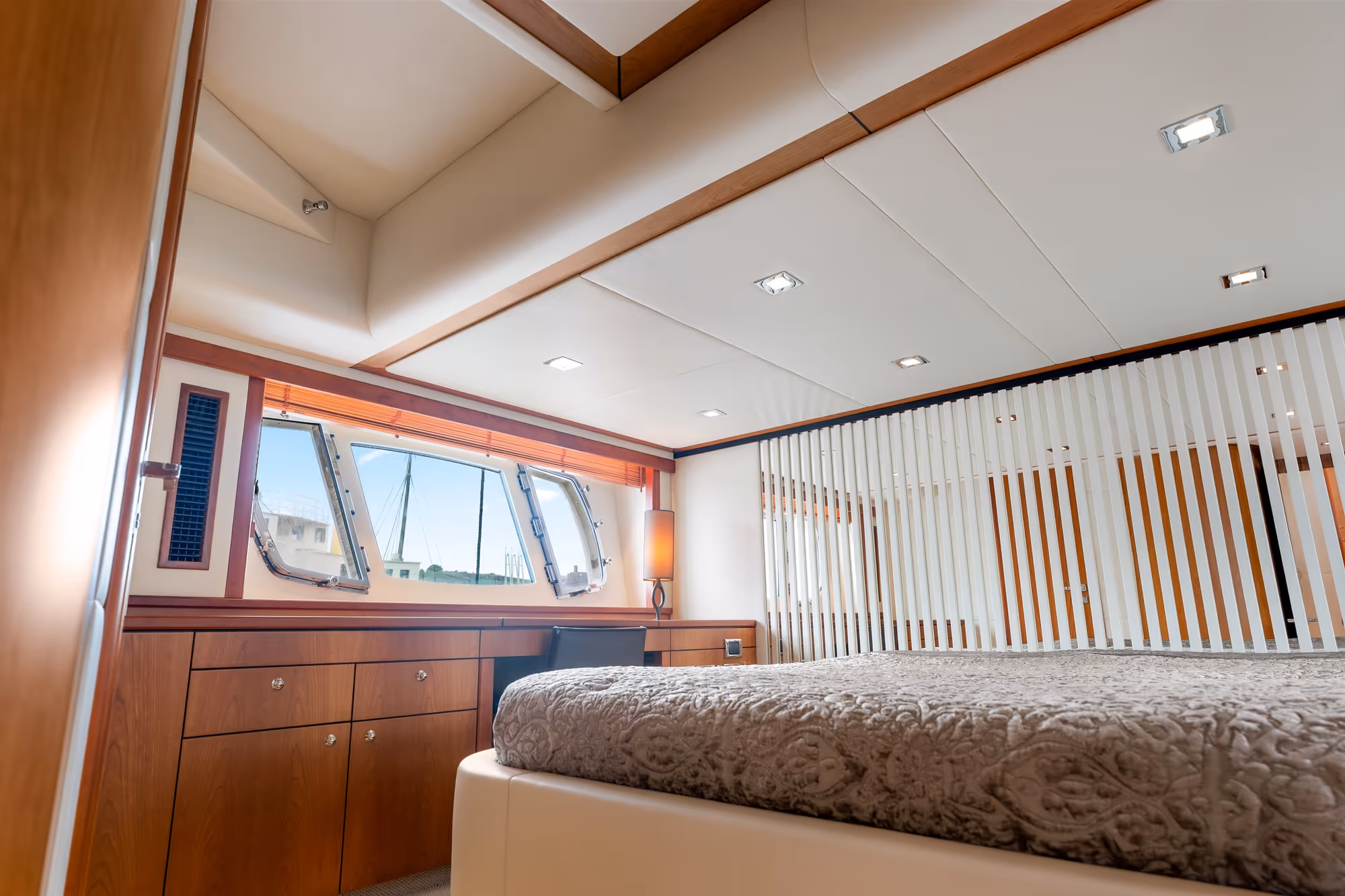 Bed, ceiling, and dressers styled precisely to the client’s bespoke vision
