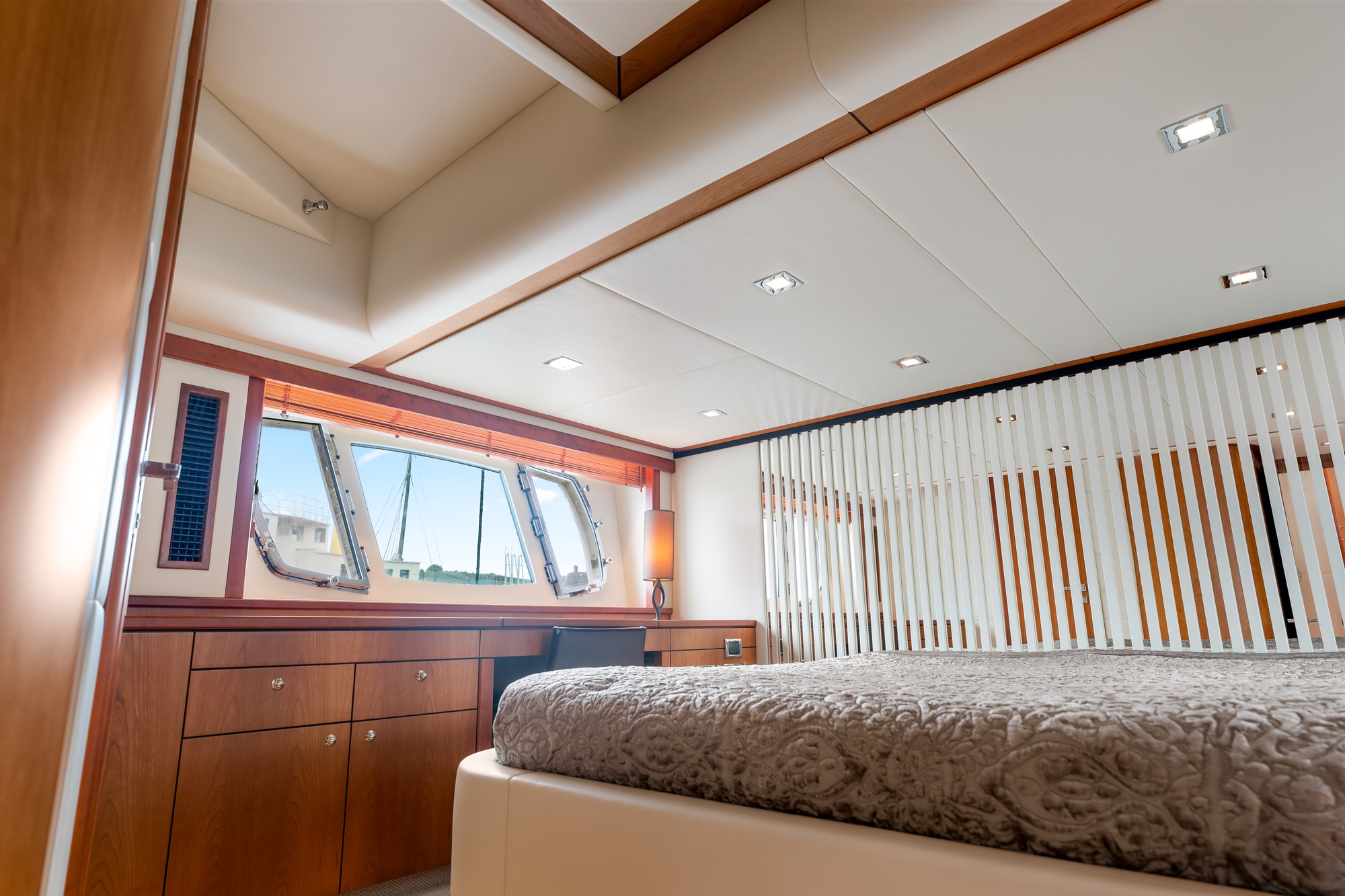 Bed, ceiling, and dressers styled precisely to the client’s bespoke vision