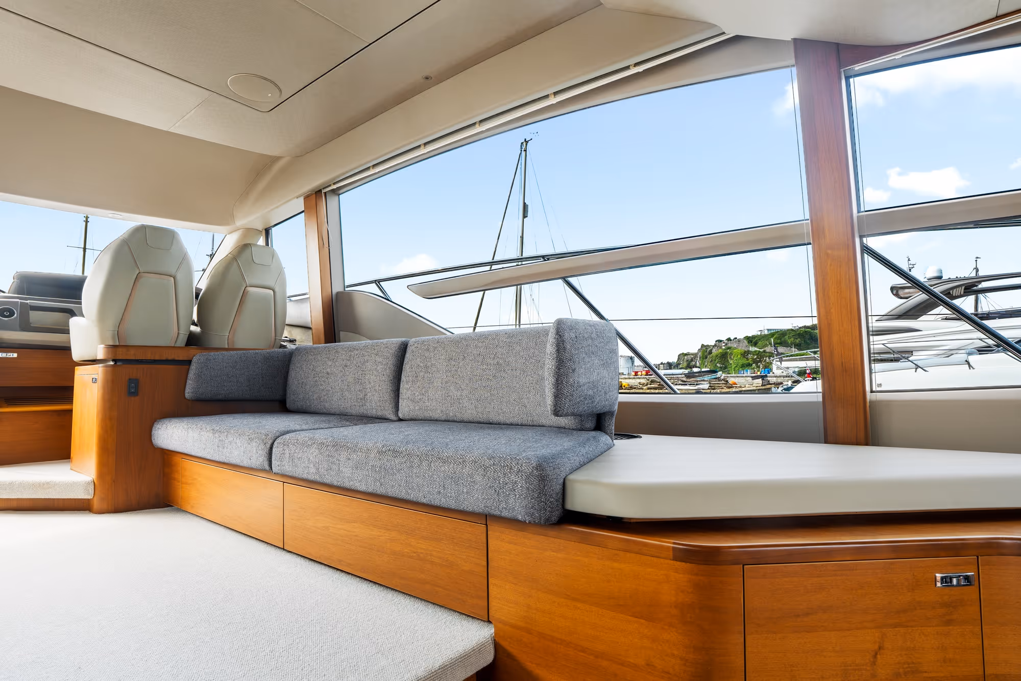 Bespoke sofa installed behind the helm for maximum onboard comfort