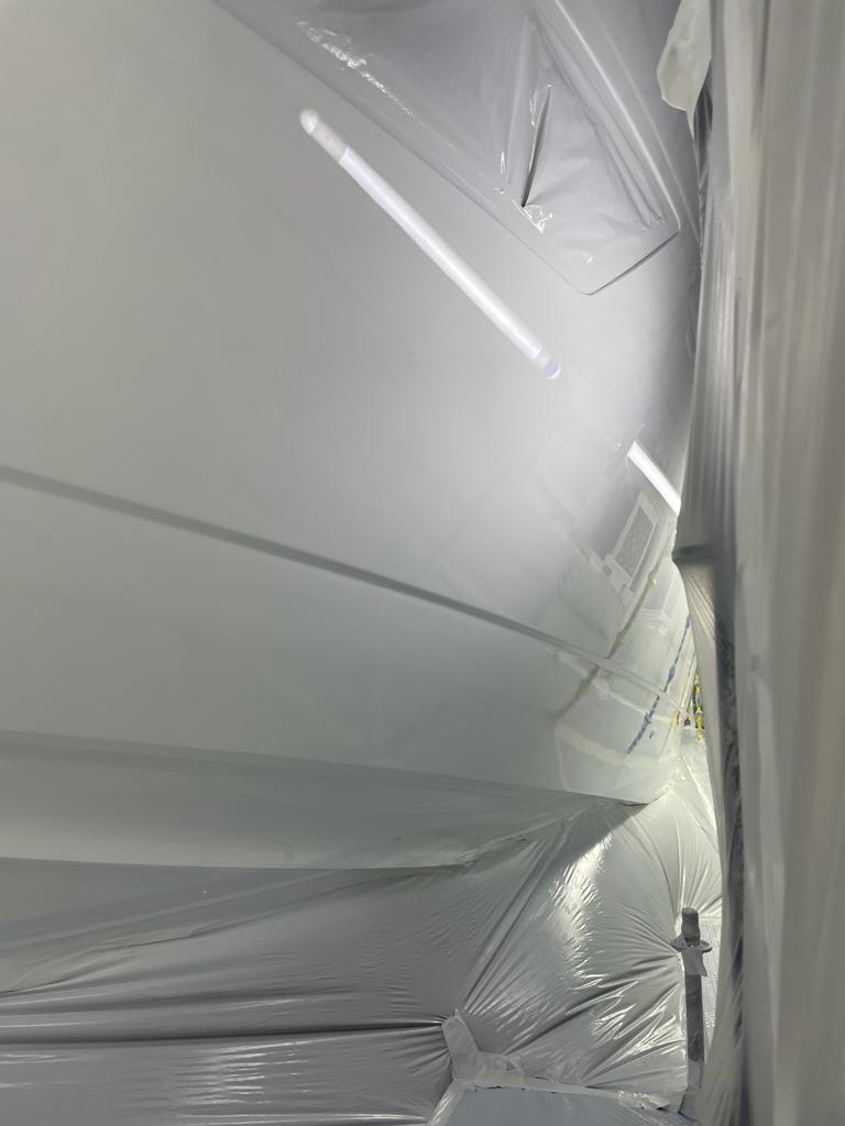 Side of the vessel expertly recoated, showcasing deep gloss and smooth finish