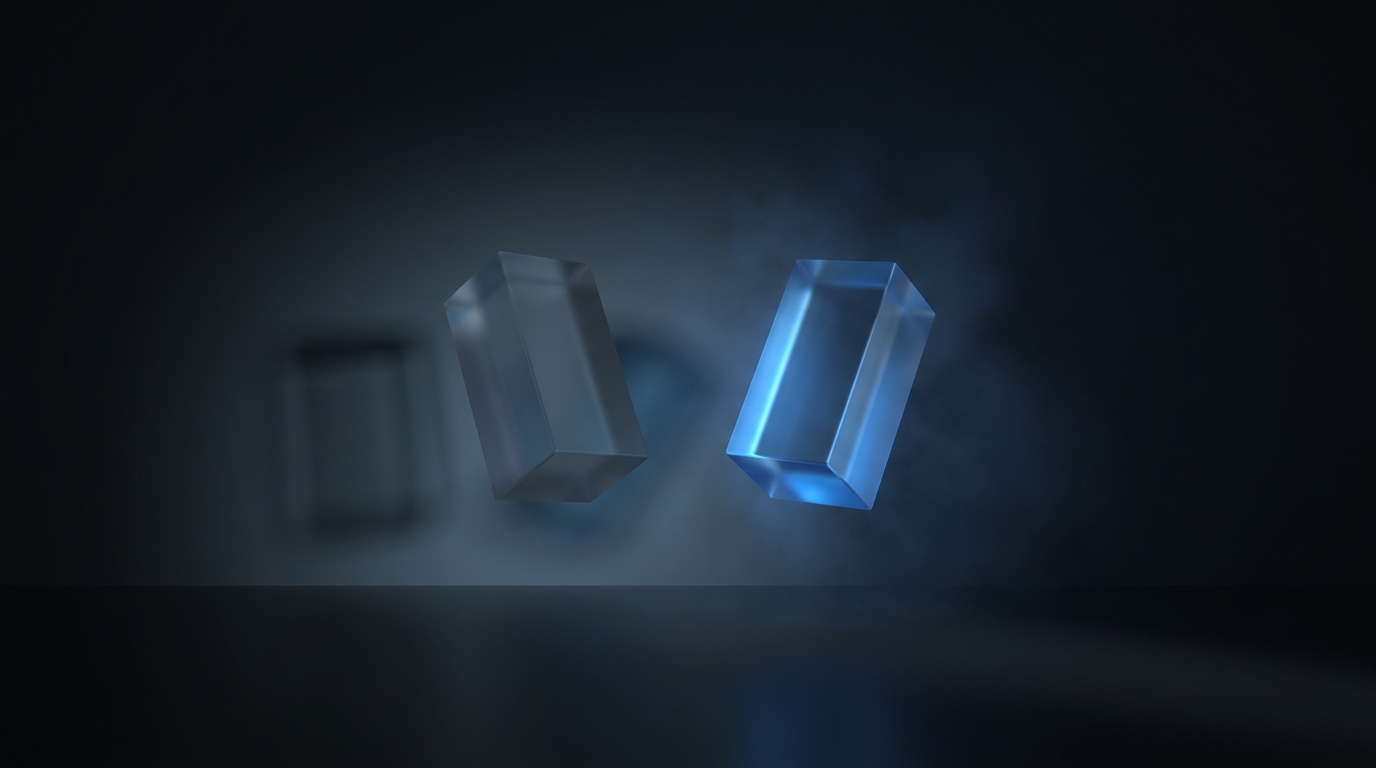 Two suspended translucent geometric prisms facing each other on a near-black background, one dimly lit and one sharply lit in electric blue, soft directional light