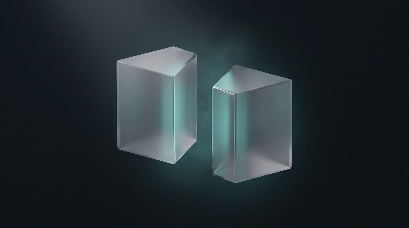 Two suspended geometric prisms in cool teal and soft gray float symmetrically against a deep slate background, lit from a single directional source with frosted glass surfaces.