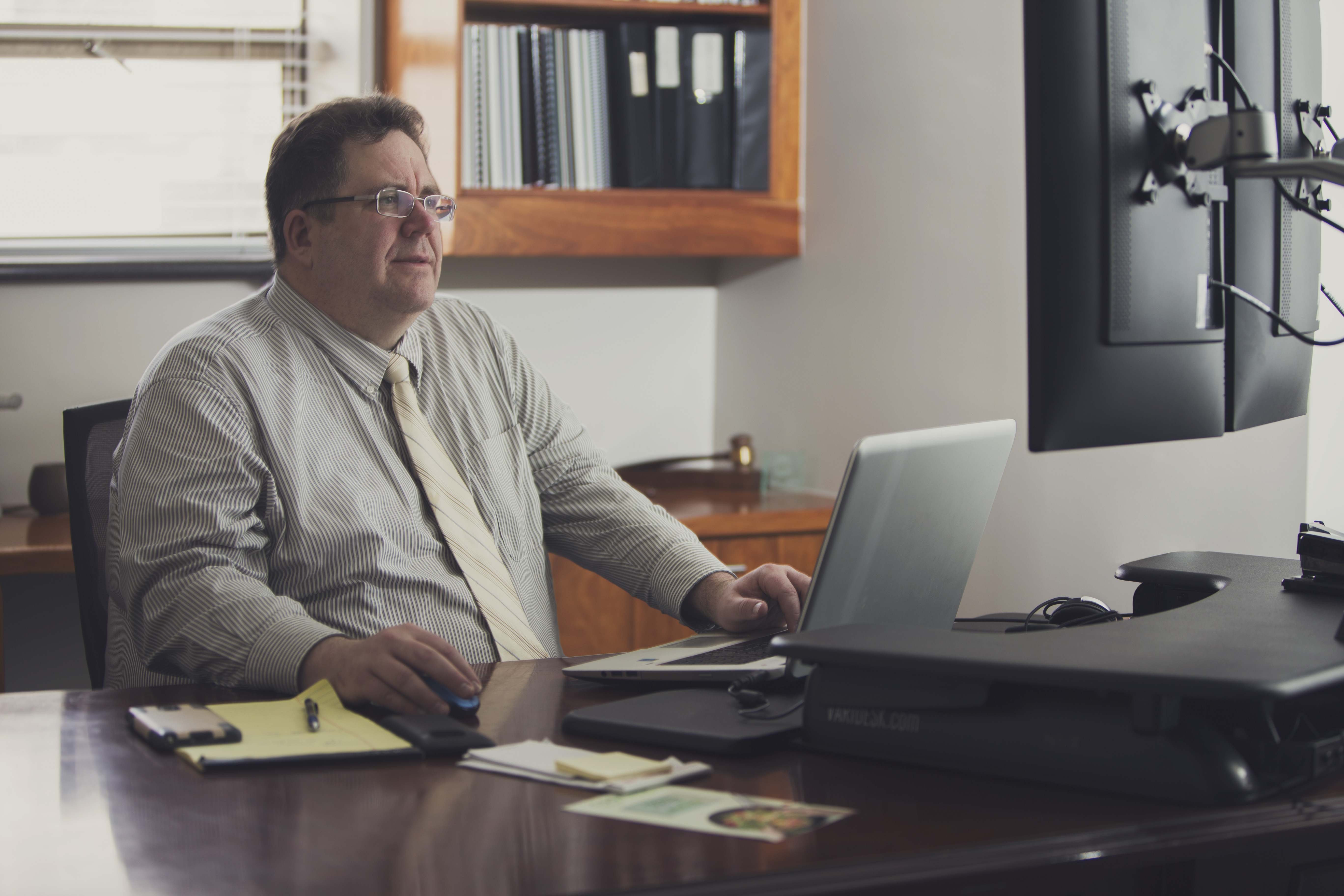 Scott Crook at desk