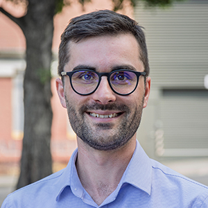 A headshot image of Dr Lachlan Johnson
