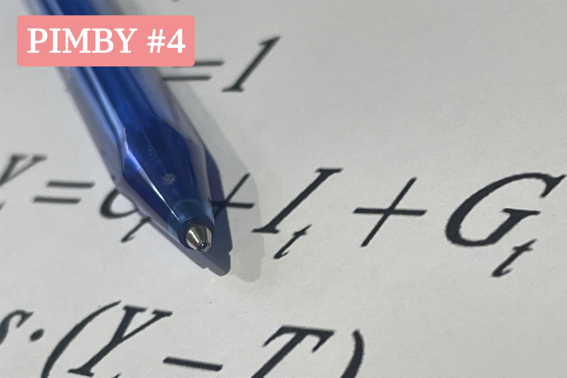 This is an image of a blue pen resting on a piece of paper that has the consumption function on it (Y = C + I + G)