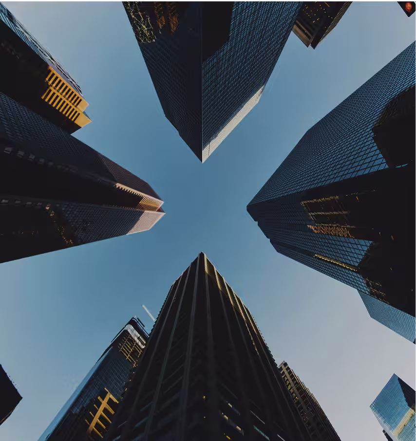picture of skyscrapers shot from the street below