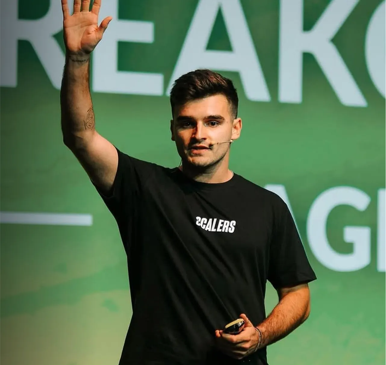A man with his hand up in the air.