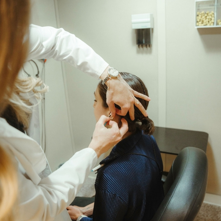 Patient learning hyperacusis management strategies with an audiologist