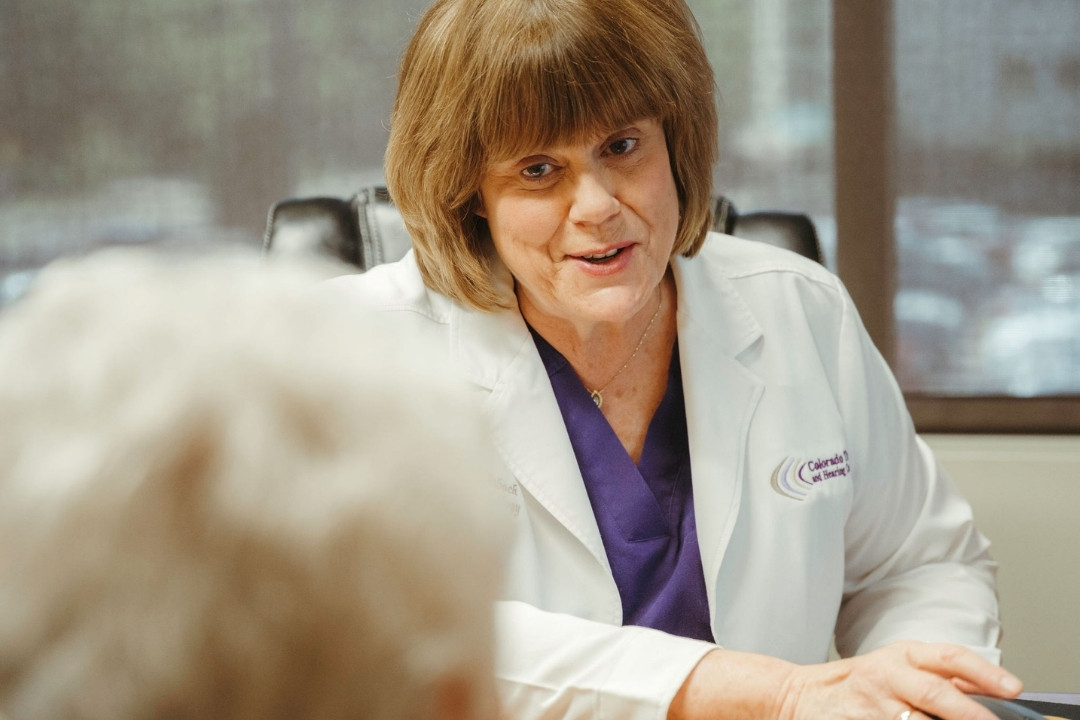 Audiologist taking ear impressions for custom hearing protection molds
