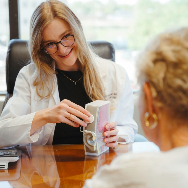 Cochlear implant device components laid out for patient education