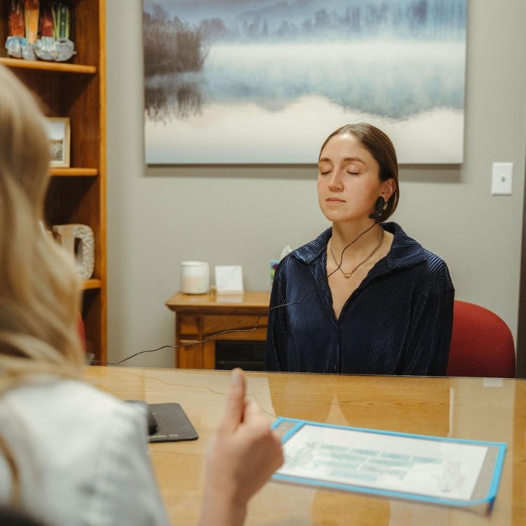 Patient using a HeartMath biofeedback device during a tinnitus therapy session