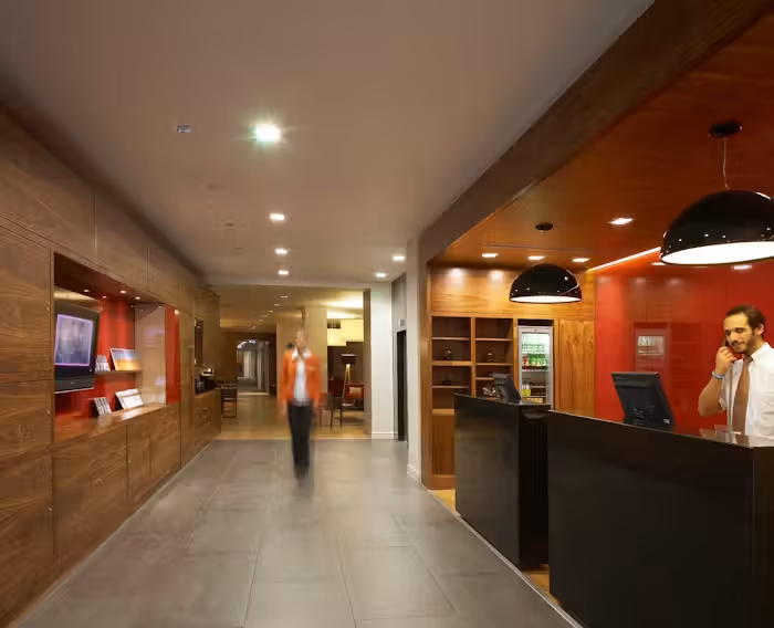 hotel reception built by mclaren construction with red wall and smooth flooring