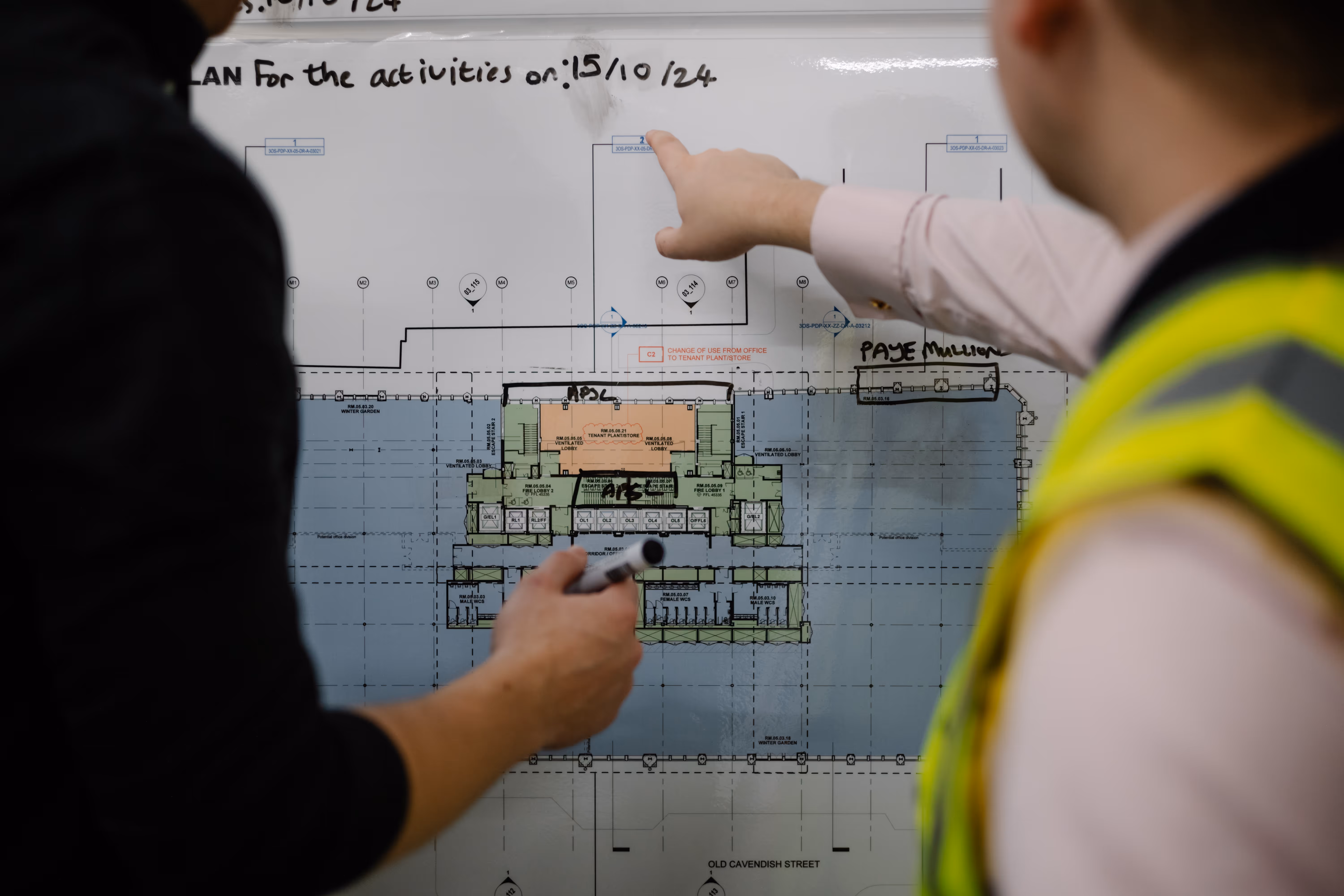 Workers looking at a construction plan