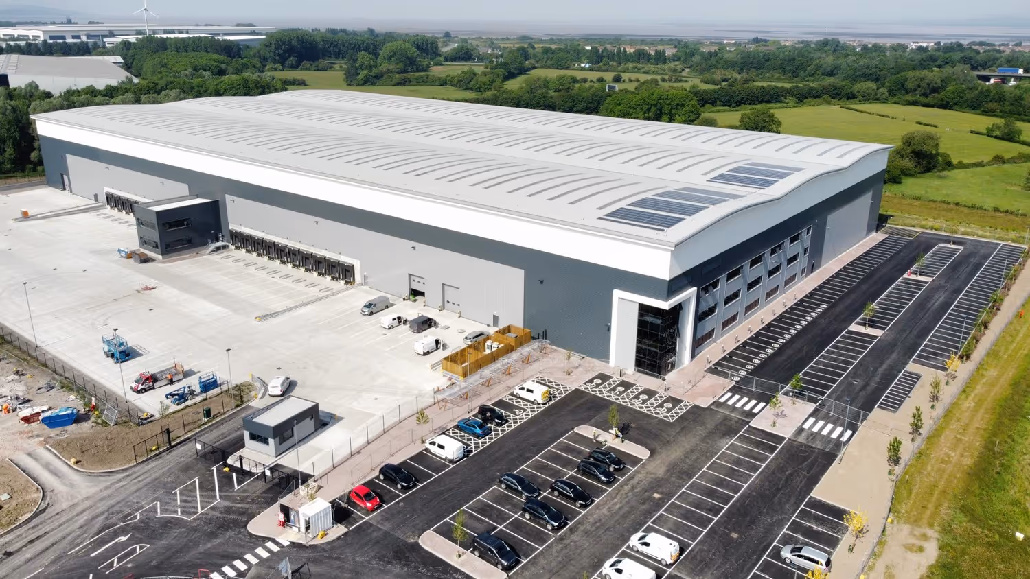 An aerial view of a large industrial building.