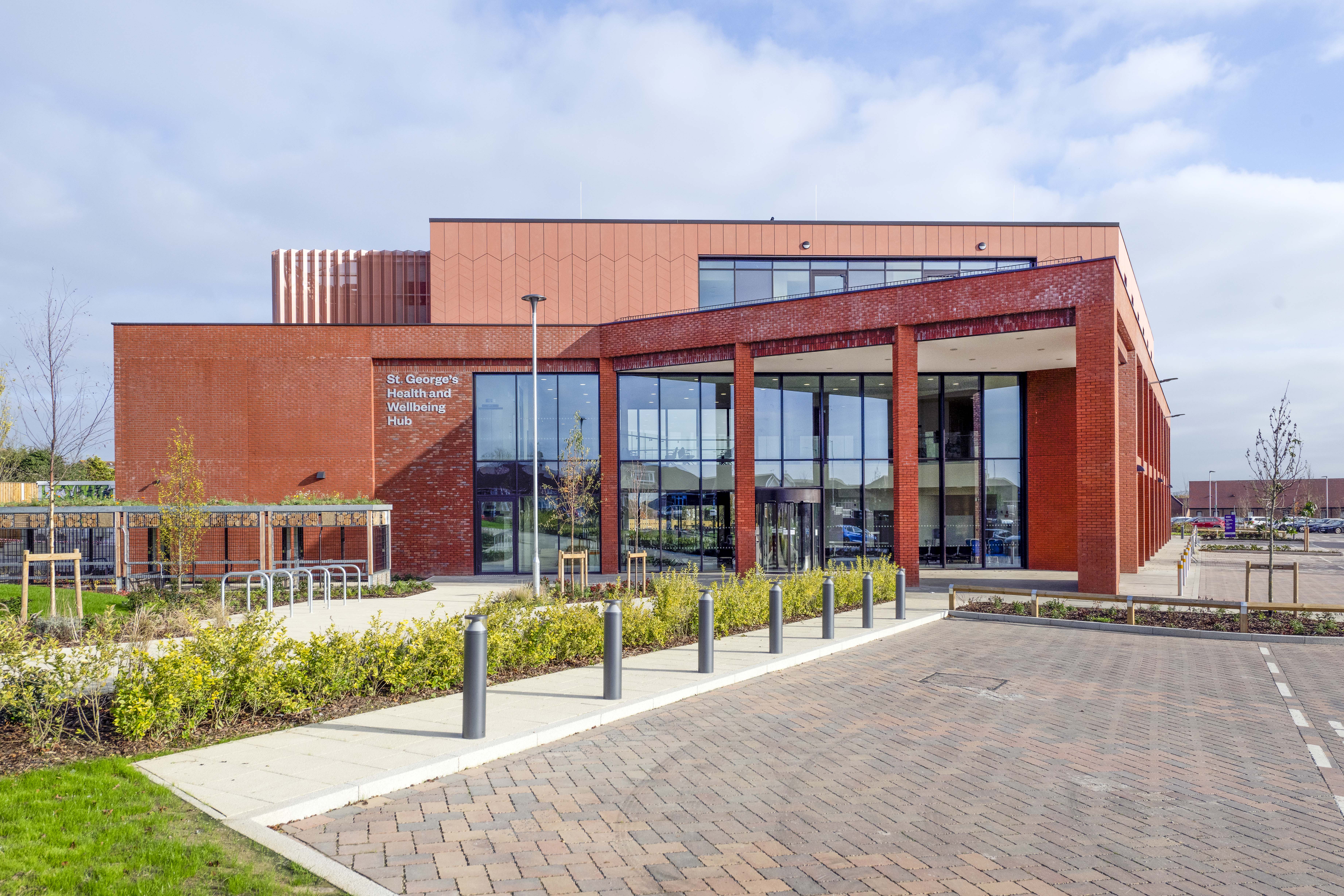 A brick building with a walkway leading to it.
