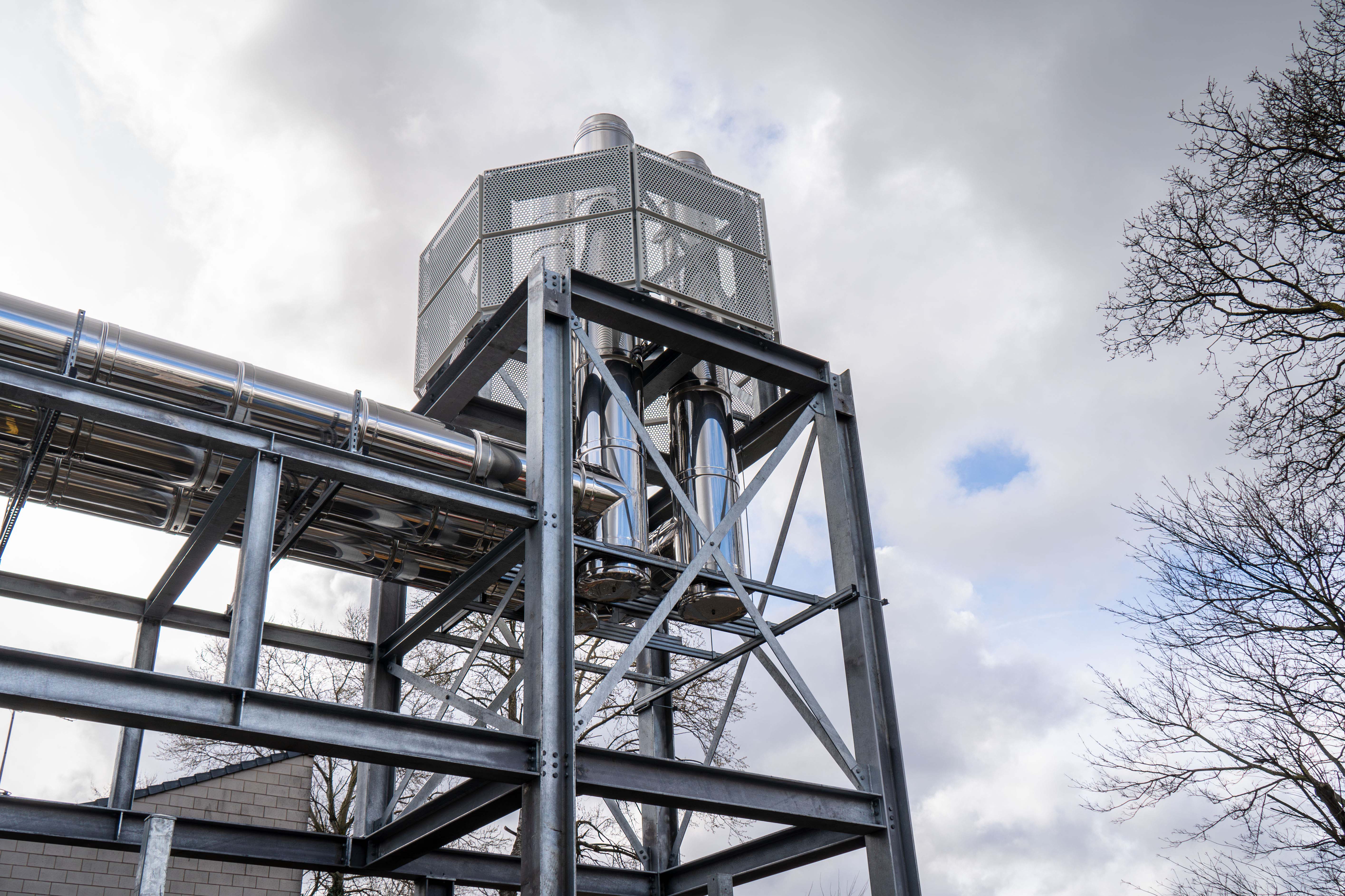 A large metal structure with a clock on it.