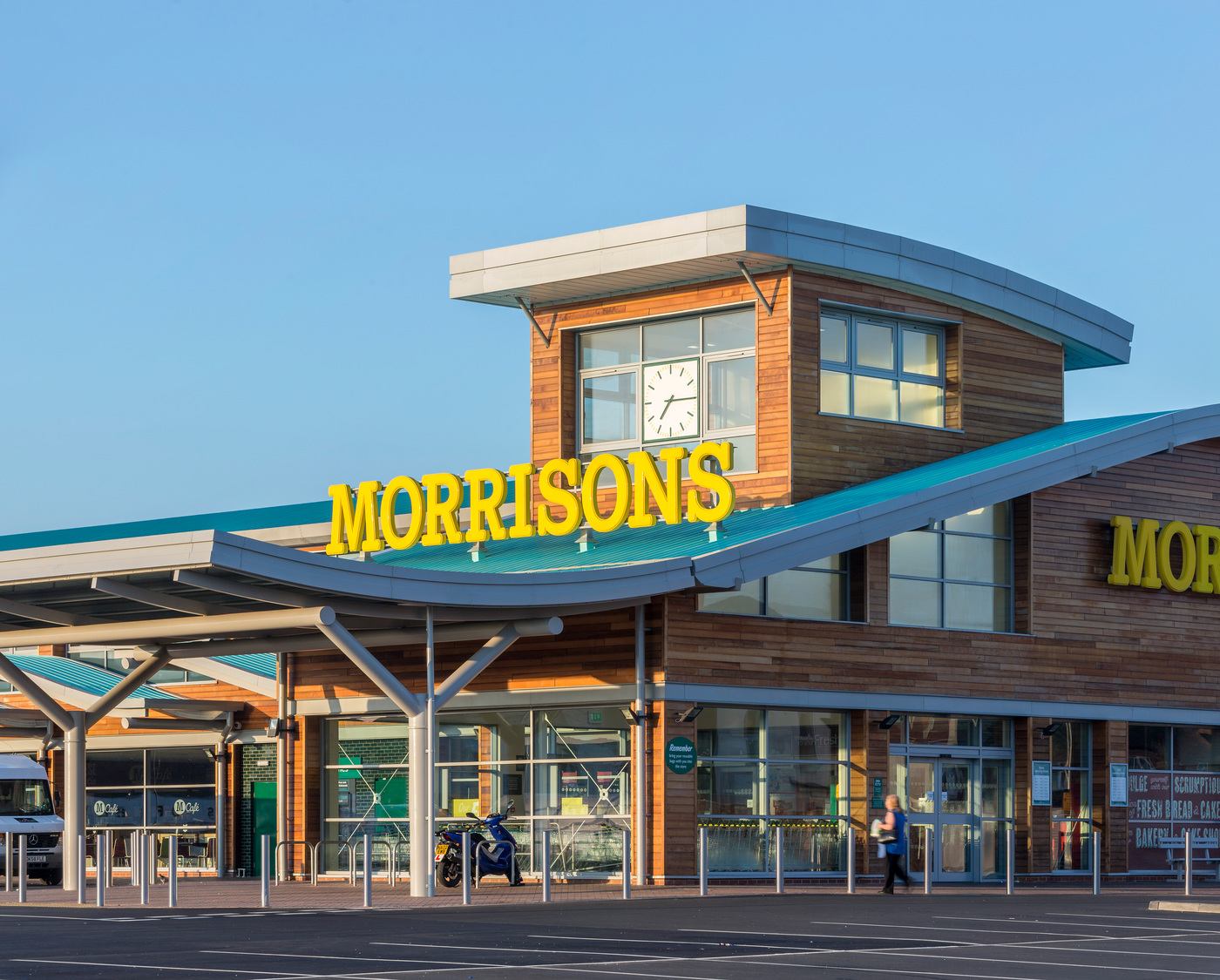 A store with a clock on the front of it.
